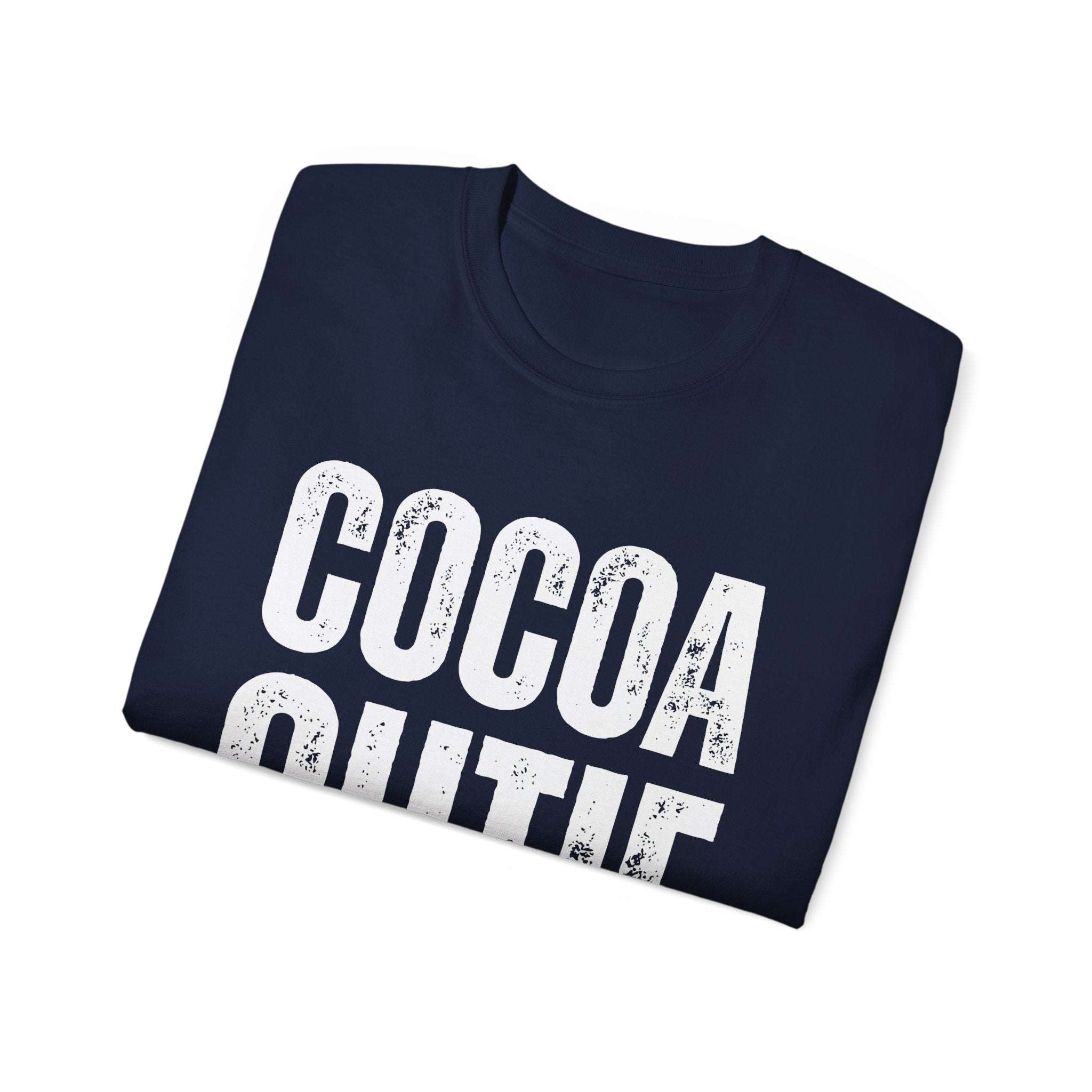 Folded navy Distressed Cocoa Cutie Tee with white vintage-style print on eco-friendly cotton