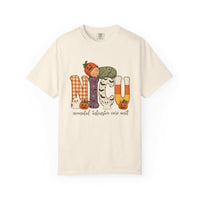Ivory NICU nurse Halloween T-shirt with patchwork lettering, a sleeping baby in a pumpkin hat, ghosts, and jack-o’-lanterns.