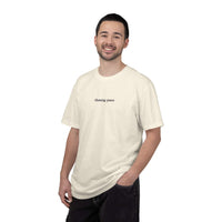 Man wearing a white t-shirt with text on a white background