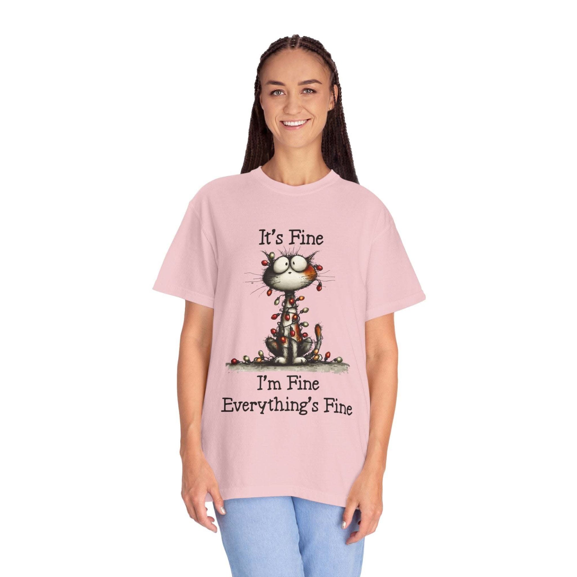 Woman wearing pink cat t-shirt with "It’s Fine, I’m Fine, Everything’s Fine" text and small cat illustration