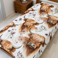 Plush blanket with floral Highland cow design in soft velveteen fabric
