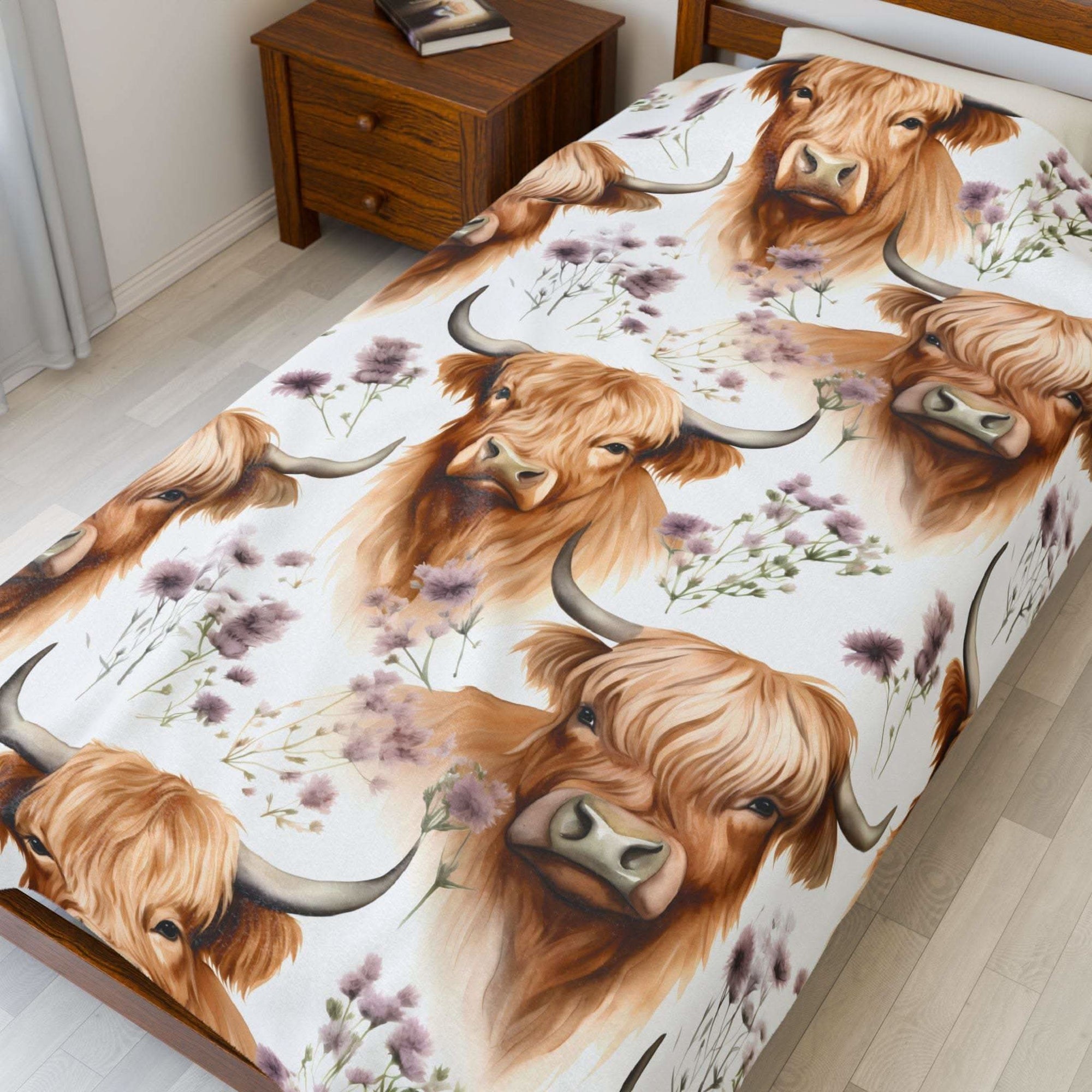 Plush blanket with floral Highland cow design in soft velveteen fabric