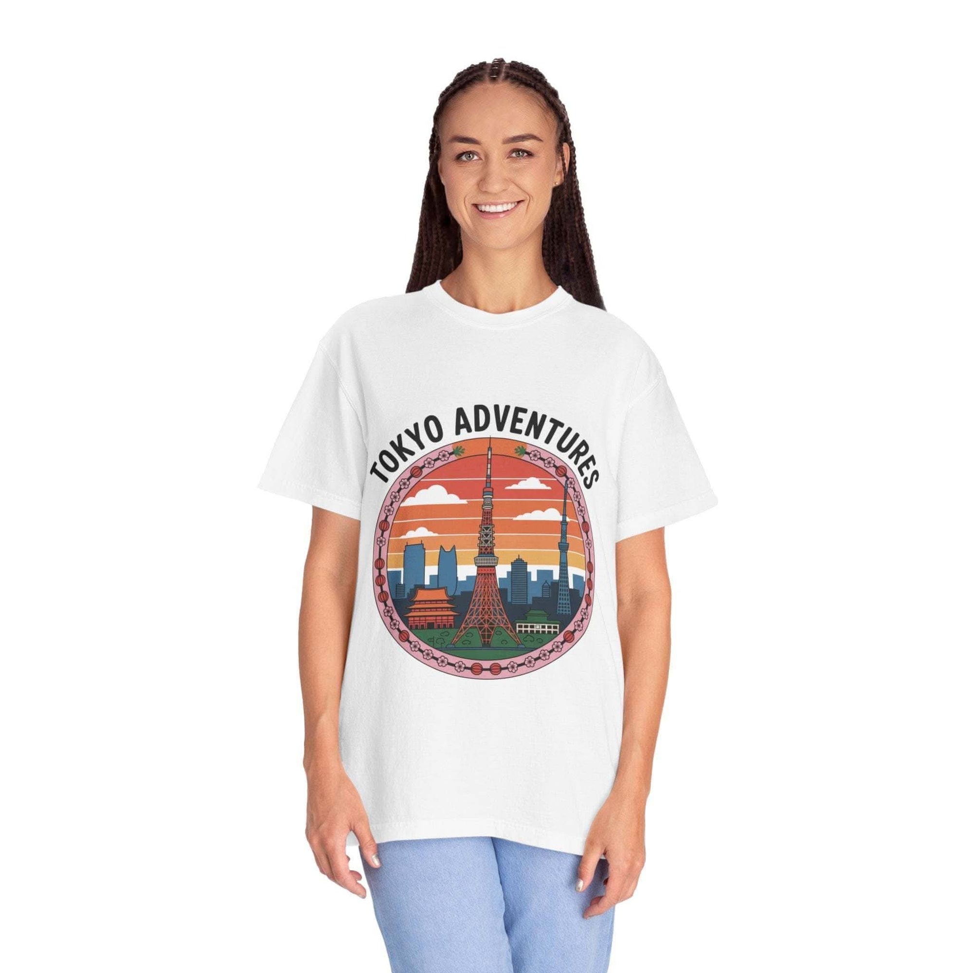 White garment-dyed T-shirt with Tokyo Adventures graphic, made of 100% cotton, worn by woman.
