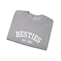 Folded gray sweatshirt with 'BESTIES EST. 2025' text on a white background