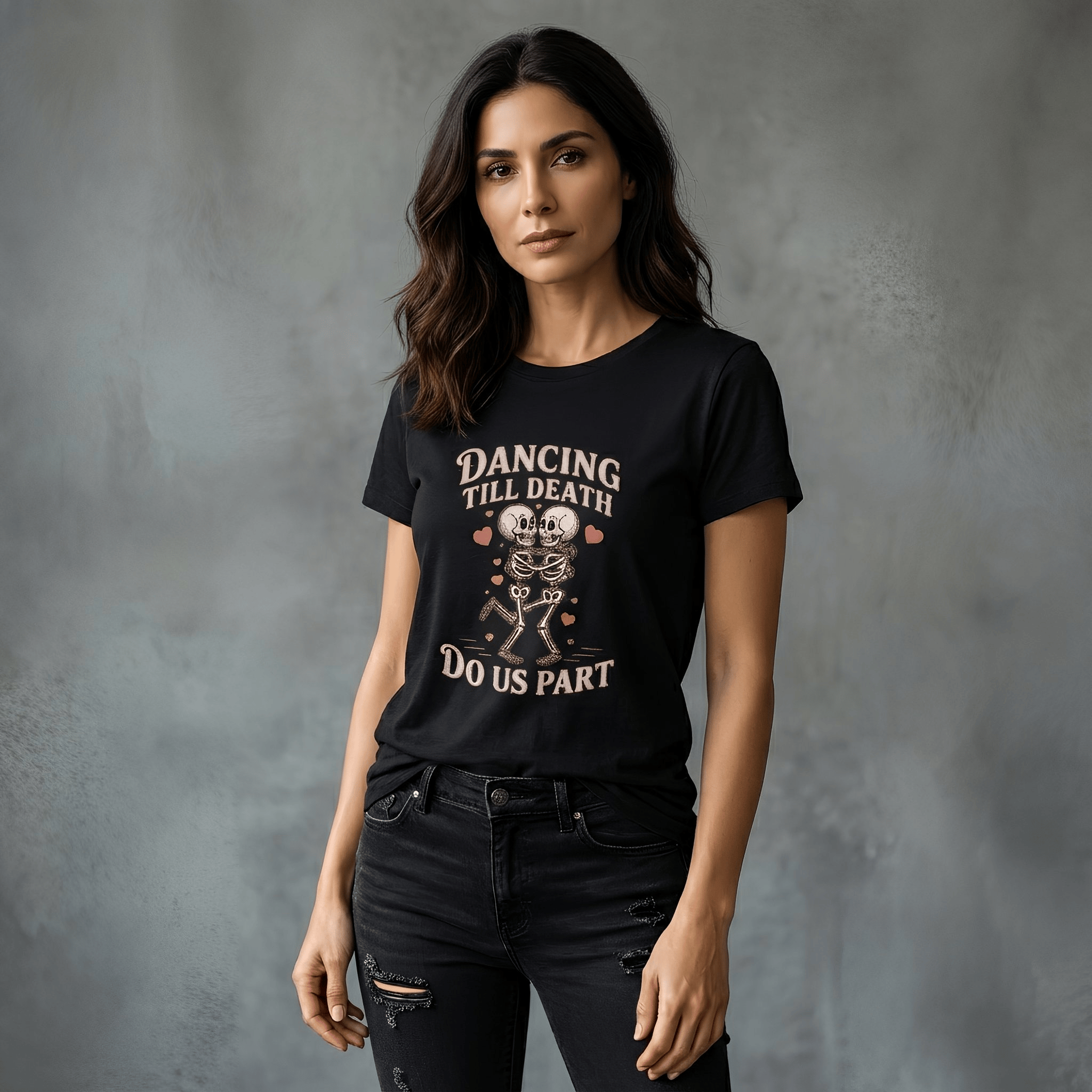 Woman wearing a black heavyweight "Dancing Till Death Do Us Part" t-shirt with skeleton graphic and relaxed fit against gray background