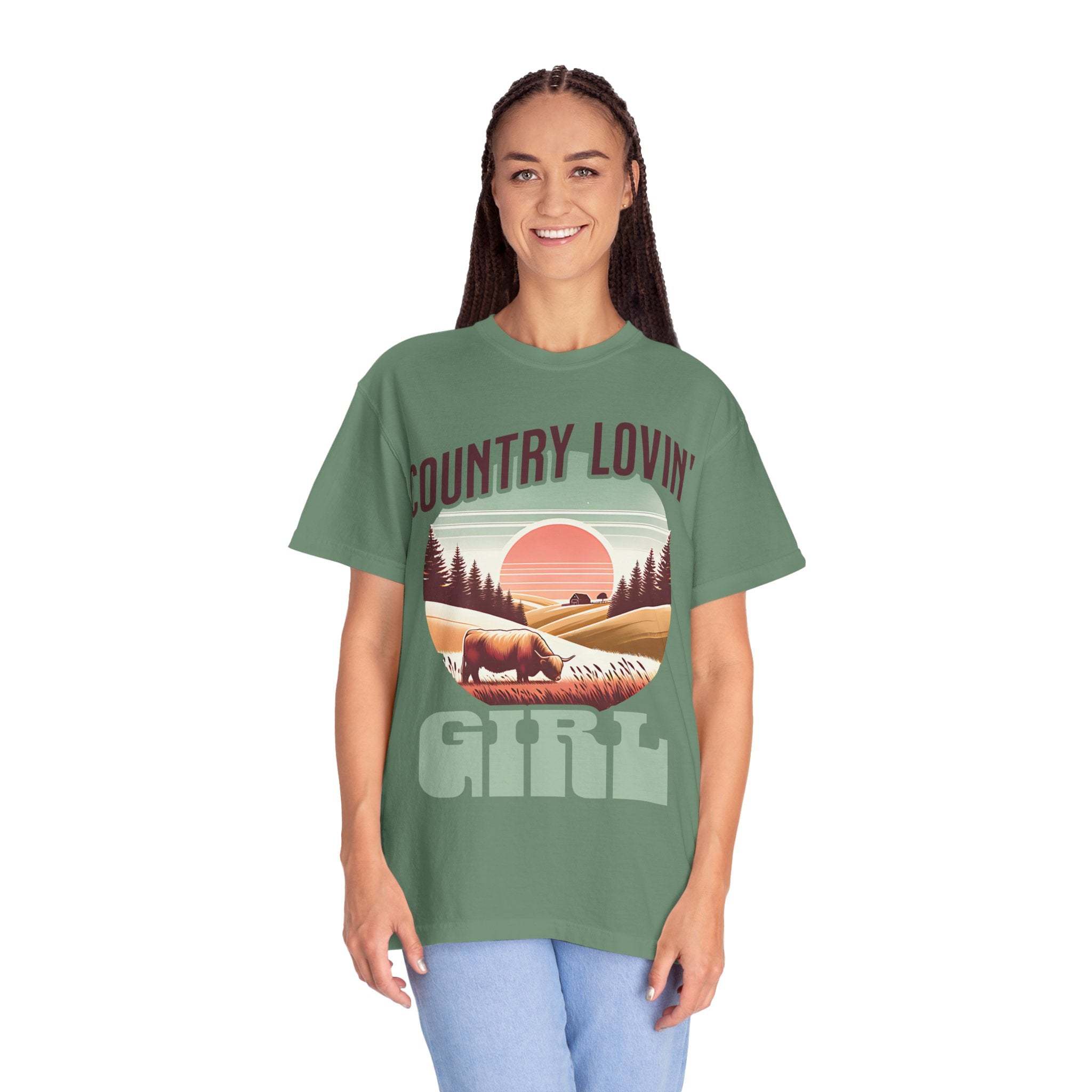 Country Lovin Girl T-shirt with vintage country landscape design on green cotton fabric worn by smiling woman