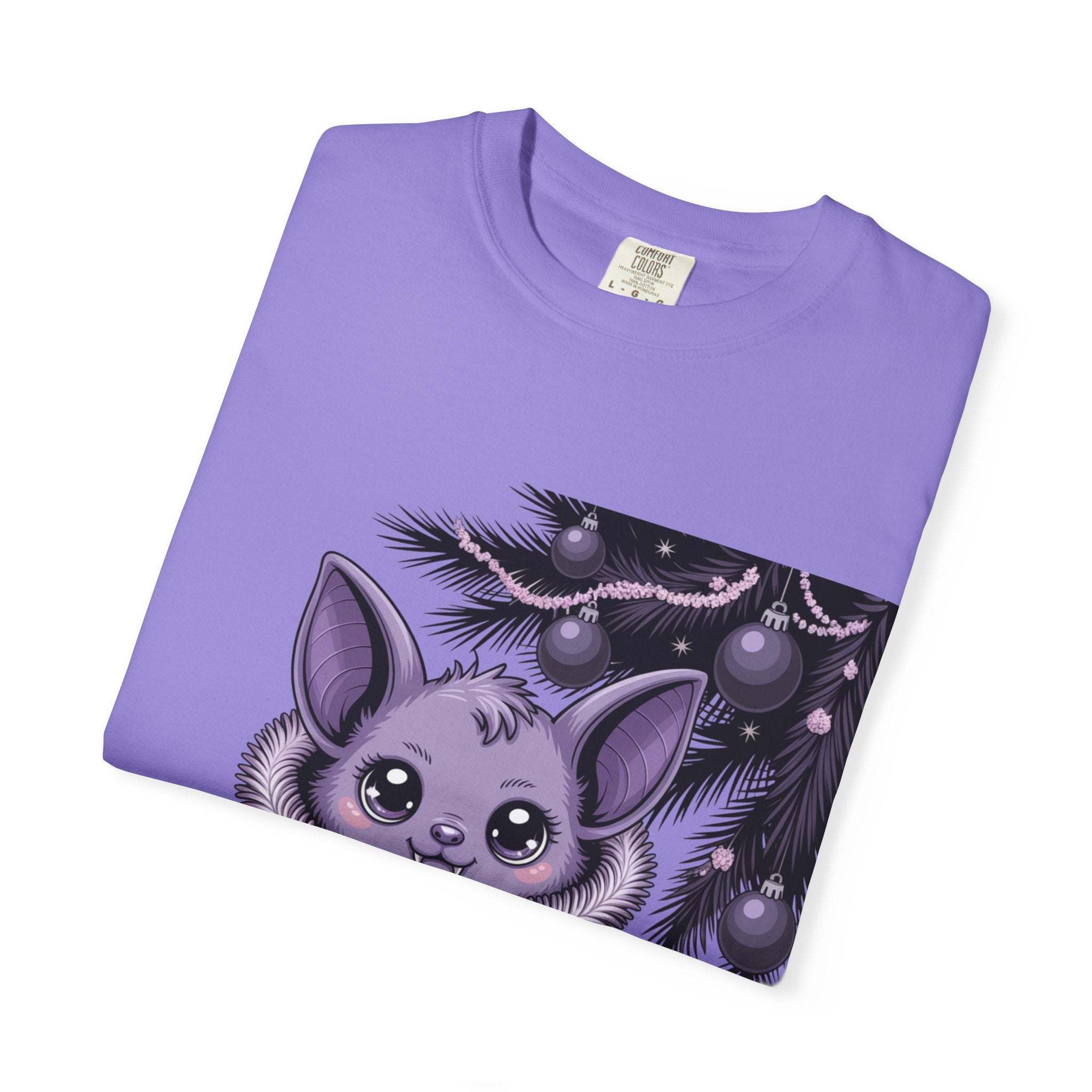 Folded purple t-shirt with a cute animal design on a white background