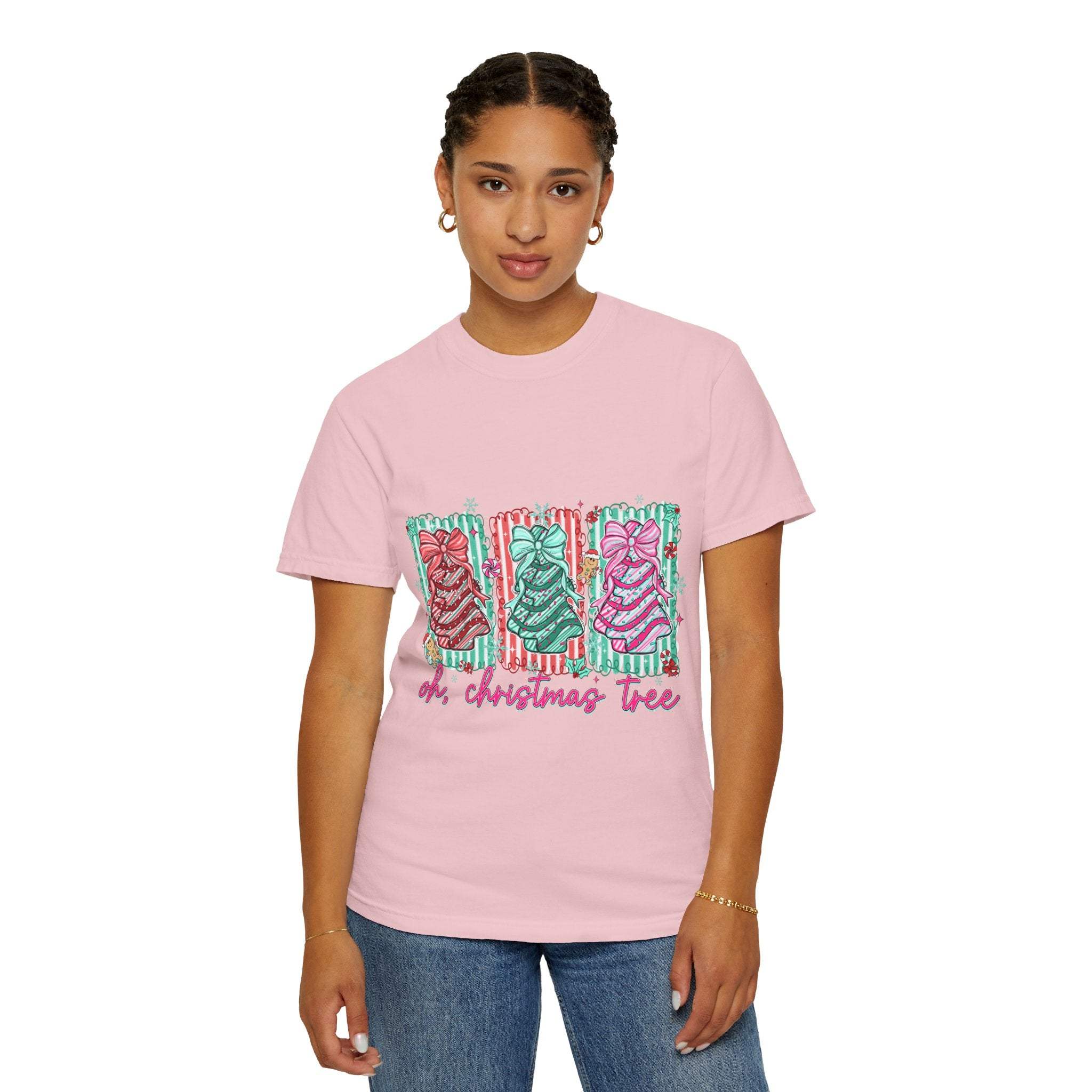 Woman wearing pink Oh Christmas Tree T-shirt with festive tree graphics and holiday text
