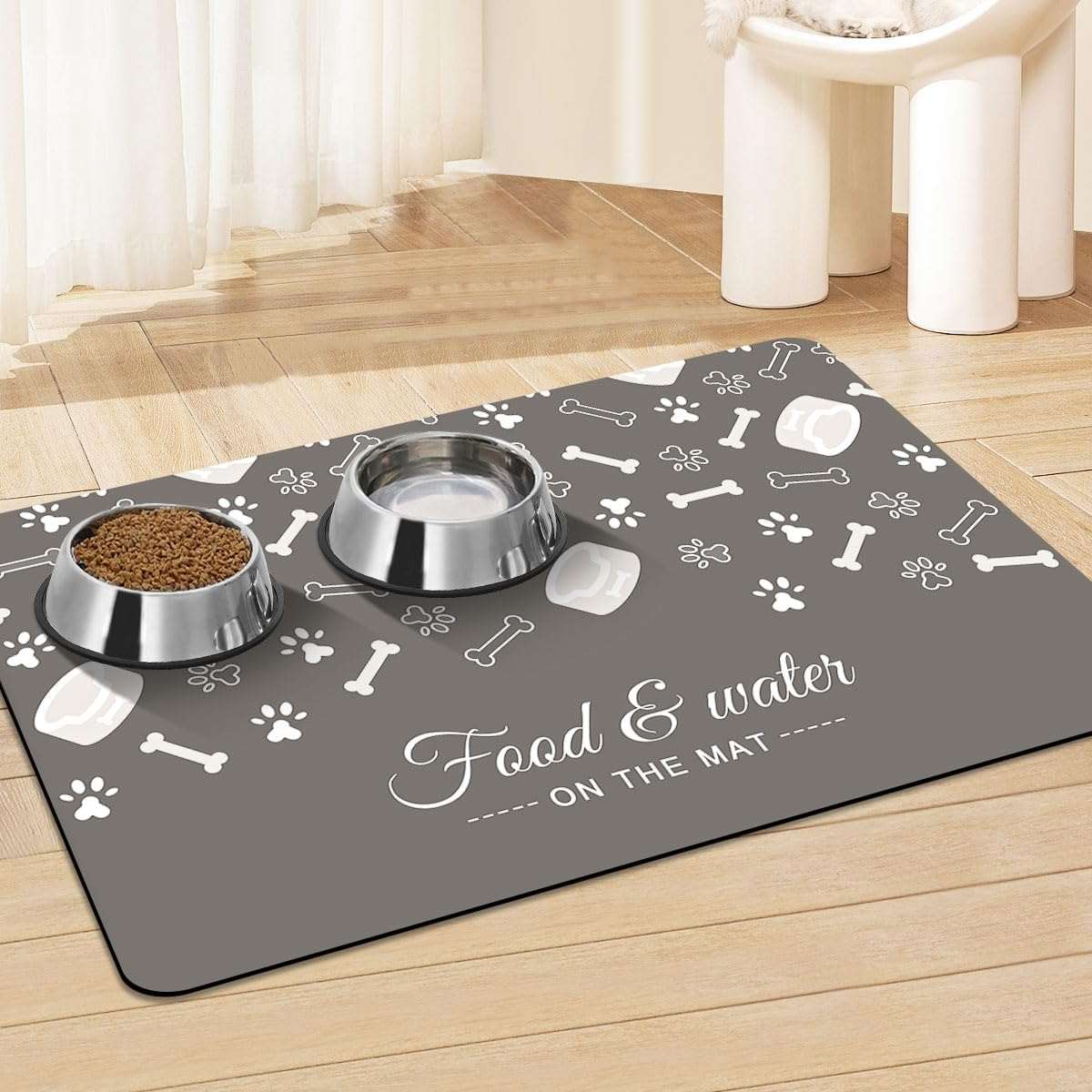 Pet feeding mat with anti-slip backing and absorbent surface under food and water bowls