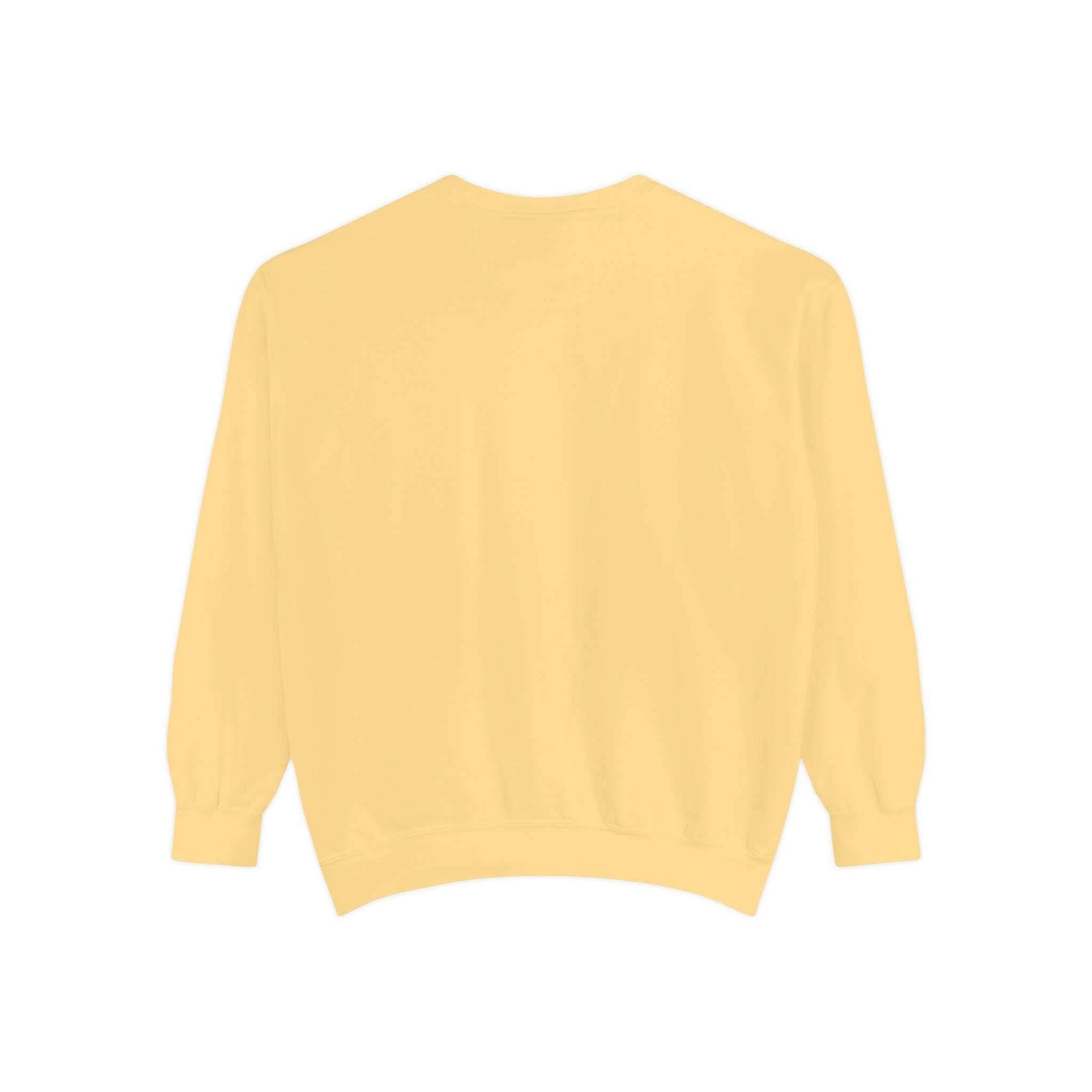 Back view of vintage Christmas Nutcracker sweatshirt in soft yellow with ribbed cuffs and hem