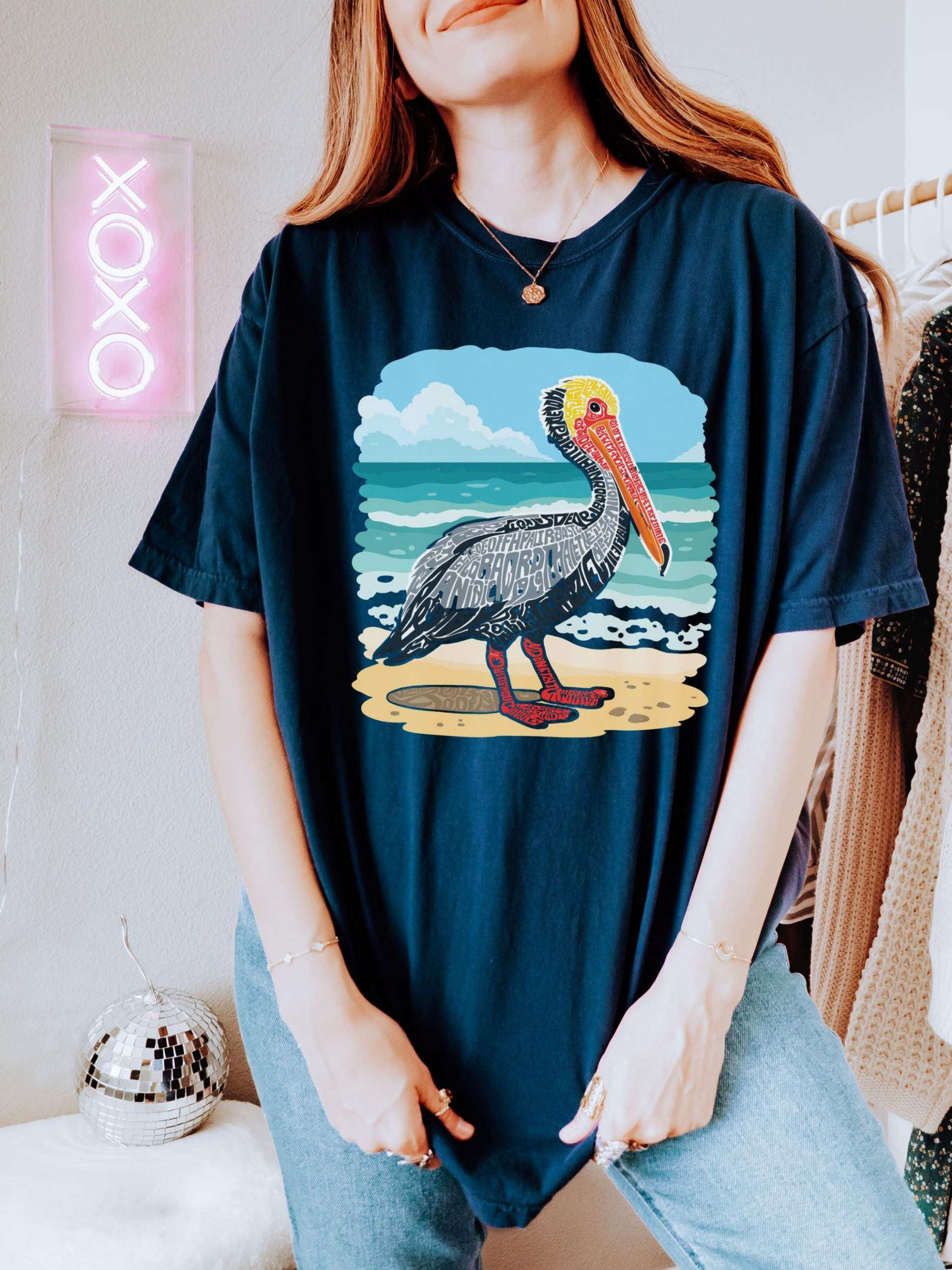 Vintage pelican letter poster graphic on soft coastal tee shirt