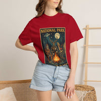 National Park After Dark t-shirt featuring campfire, Sasquatch, Mothman, and nocturnal woodland creatures in vintage style