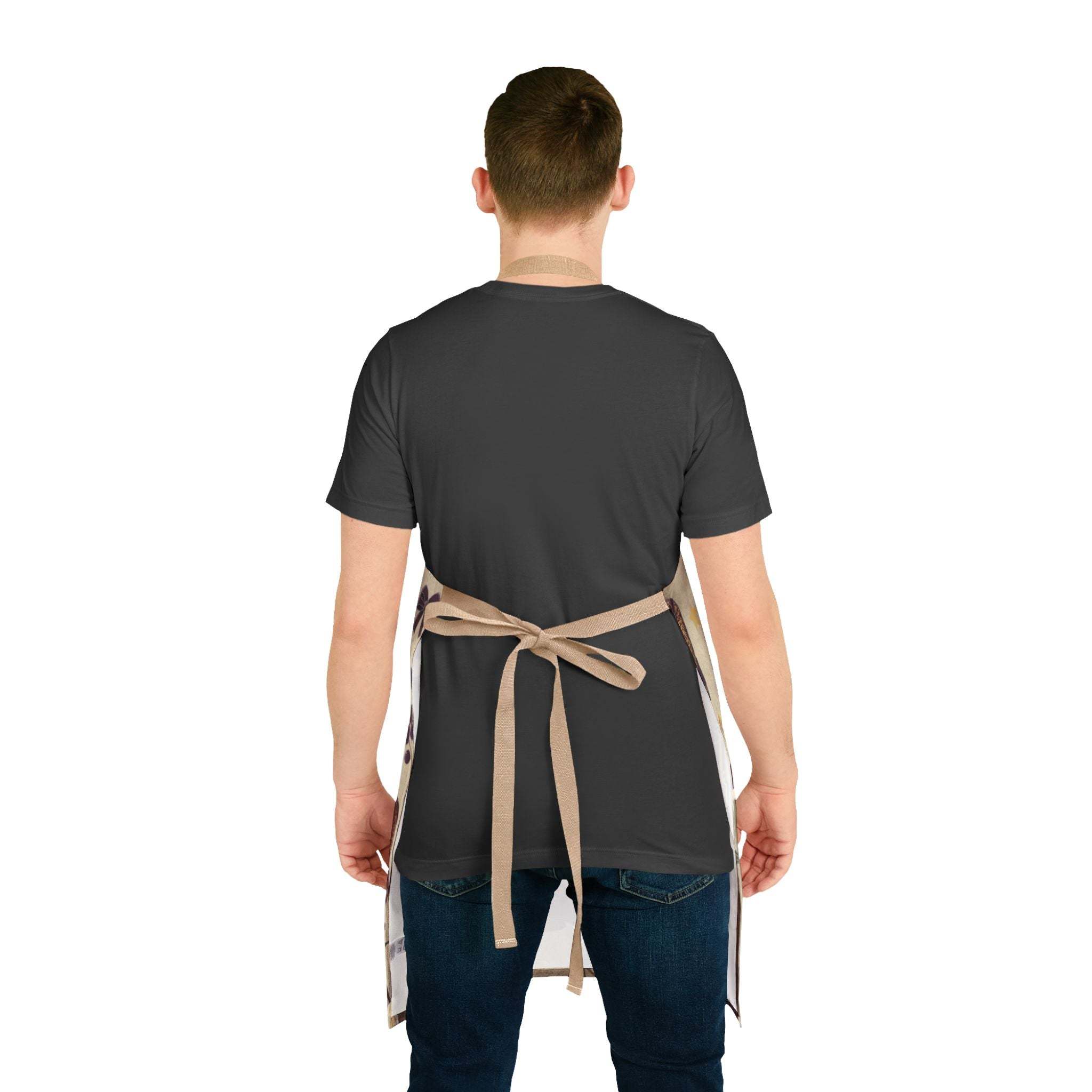 Man wearing Cowboy Christmas apron tied at back over black t-shirt and jeans
