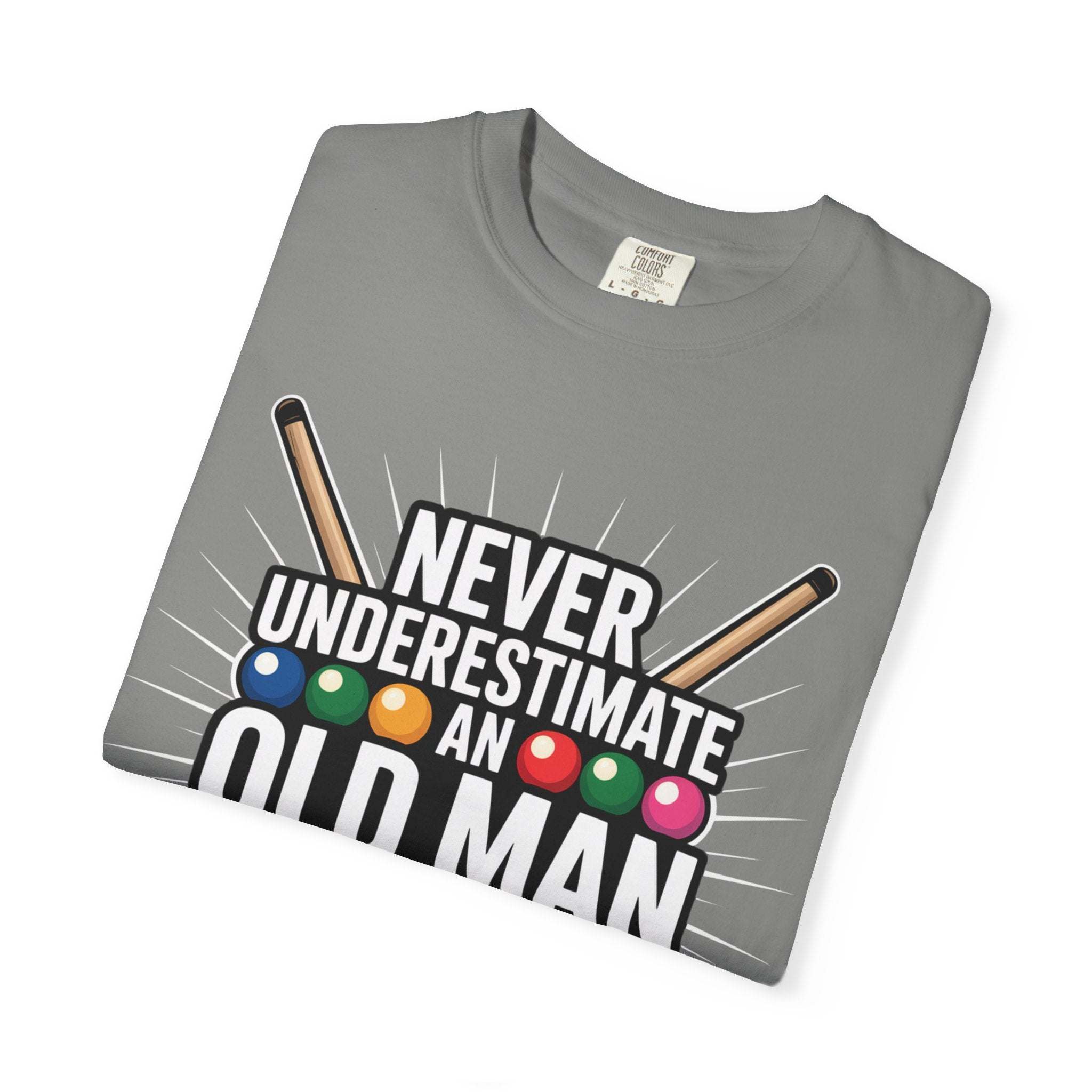 Never Underestimate An Old Man with Pool Cue T-Shirt folded with billiard balls graphic on gray cotton tee