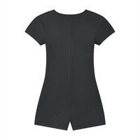 Woman wearing a women’s ribbed tie-waist cape romper with a scoop neckline and short sleeves in a fitted Y2K athleisure style