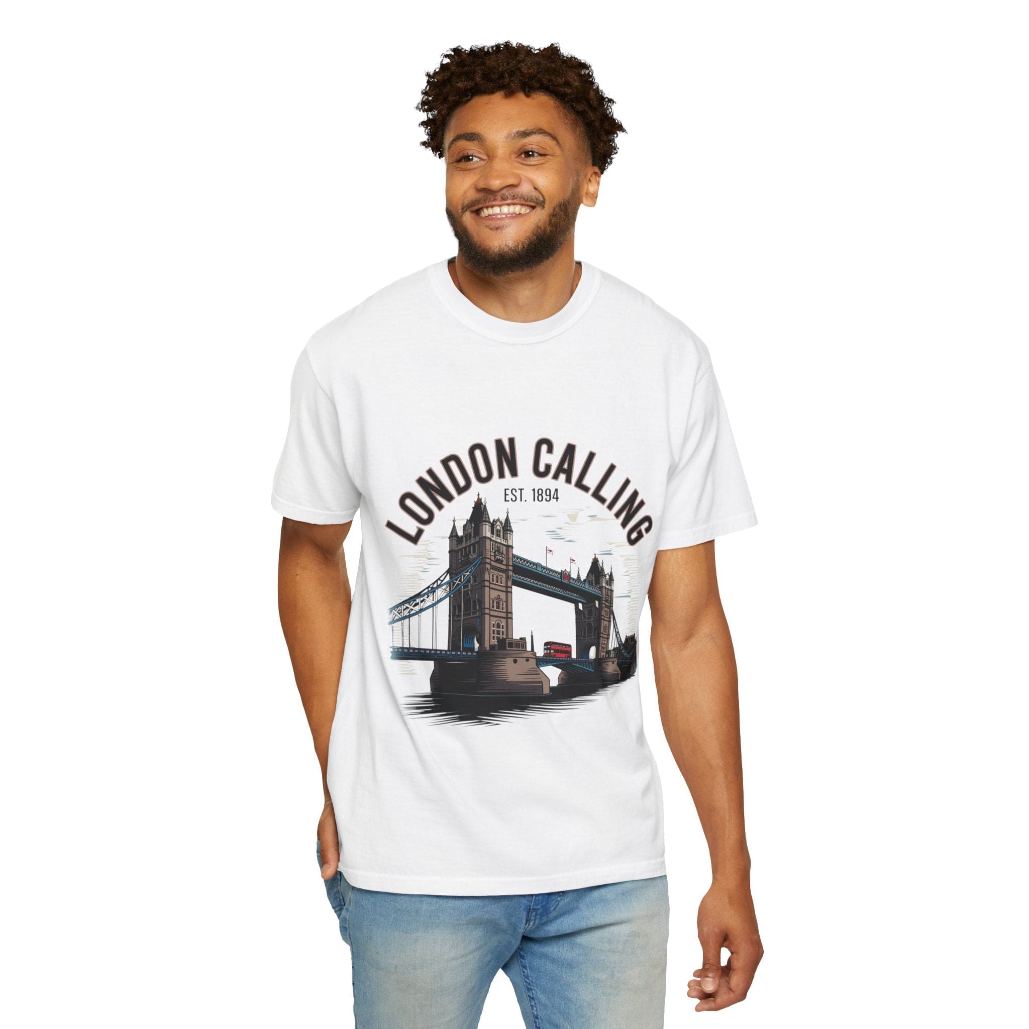 Man wearing white London Calling Travel T-shirt with Tower Bridge graphic and casual jeans