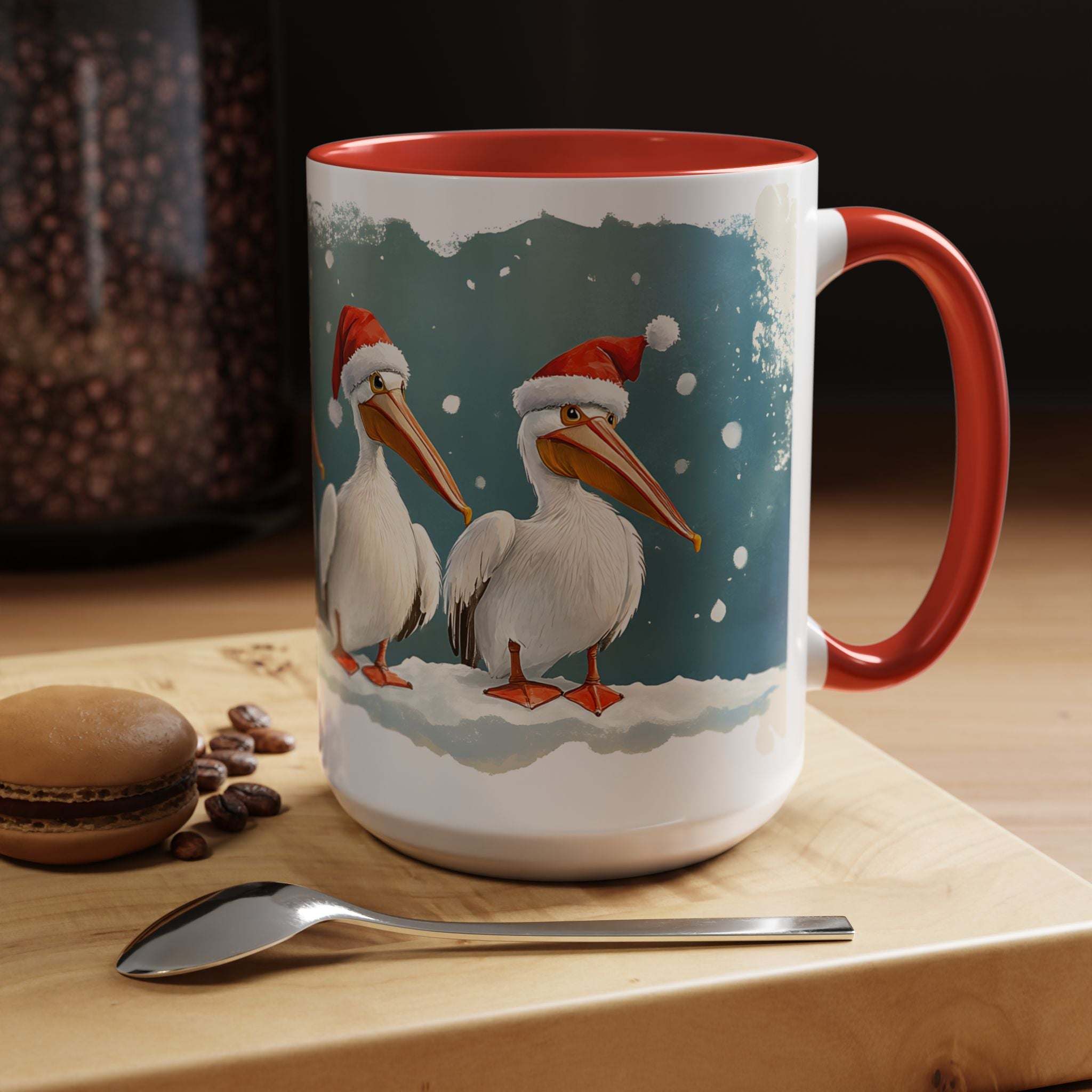 Mug with Christmas-themed design of pelicans wearing Santa hats on a wooden surface with coffee beans and a cookie.