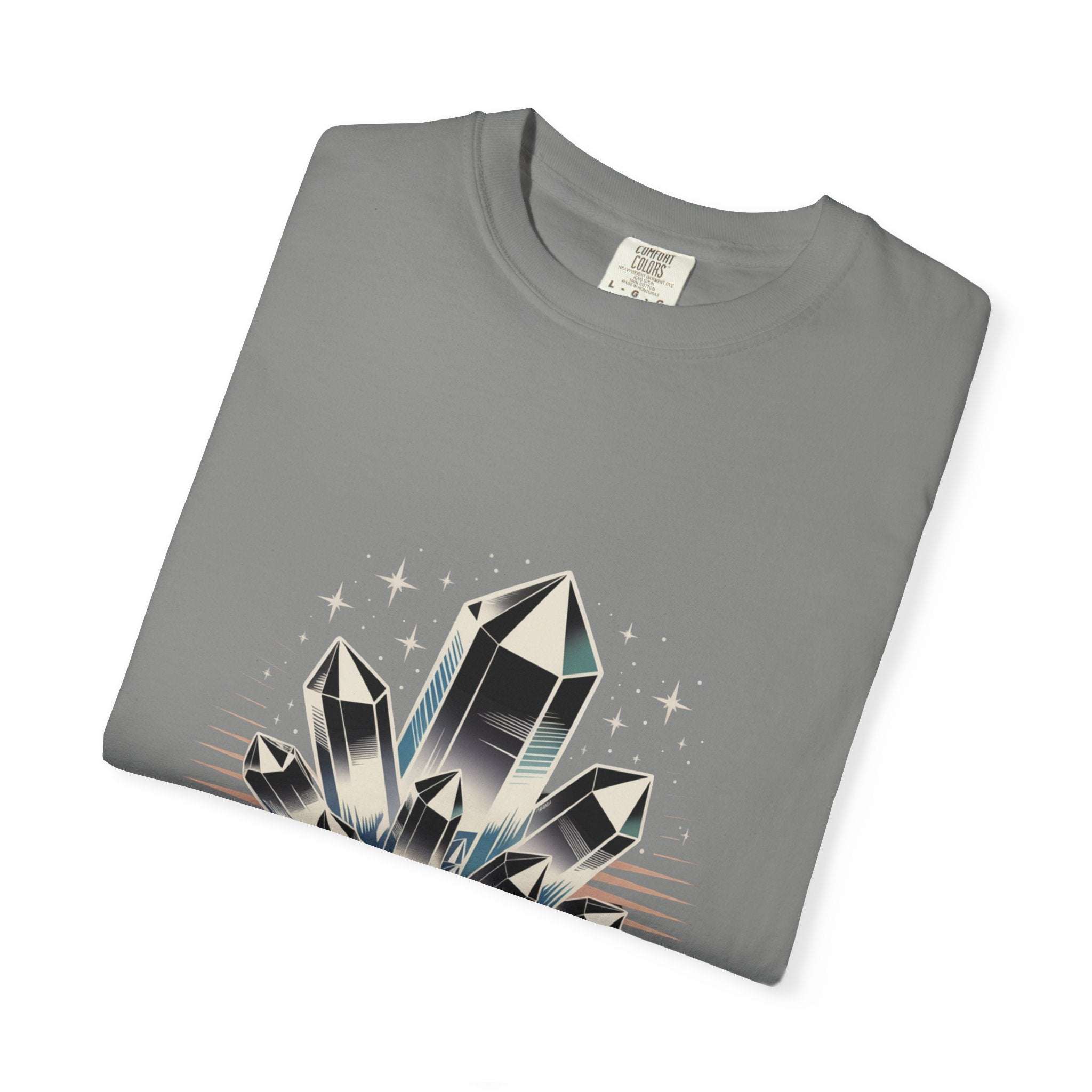 Folded gray t-shirt with crystal graphic design on a white background