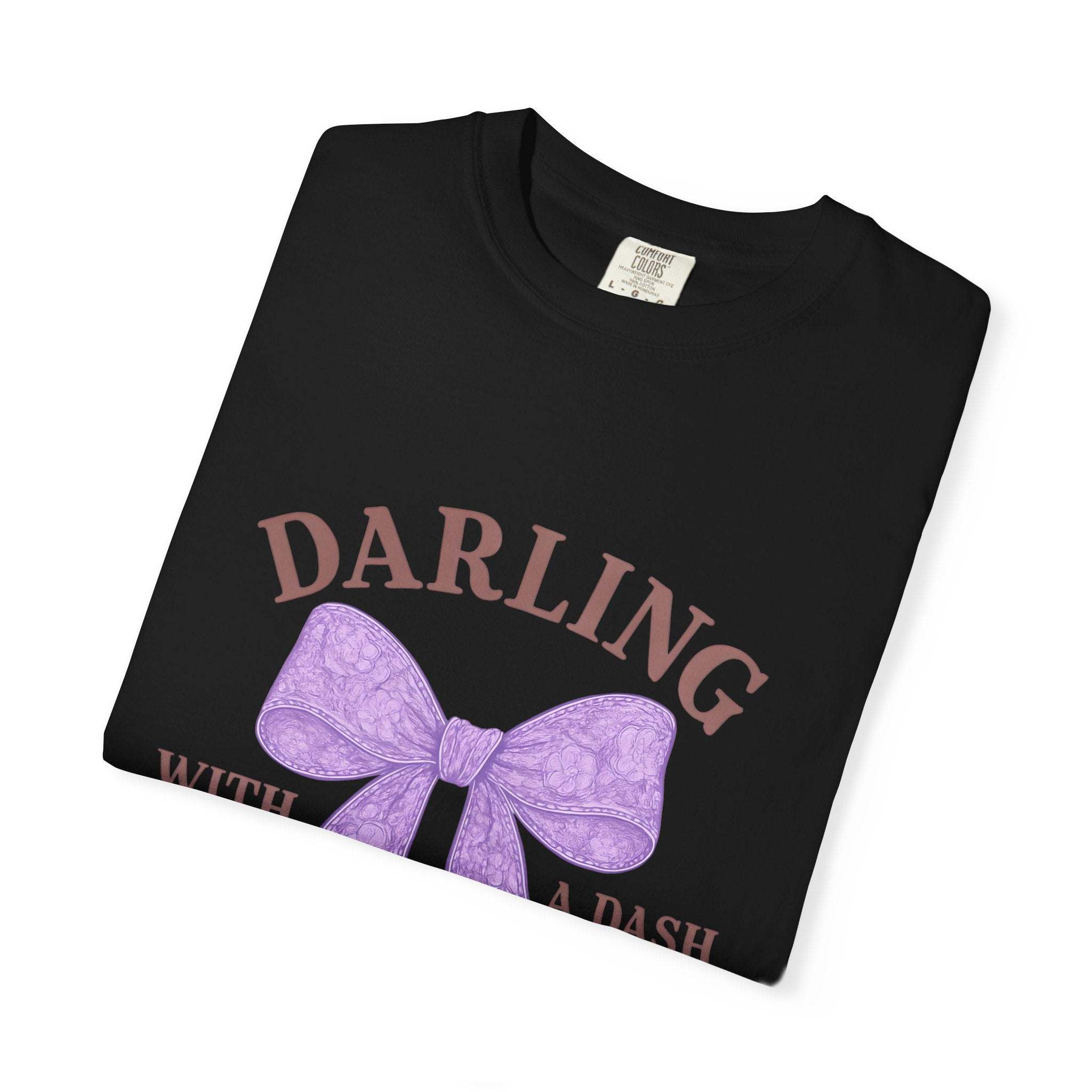Black t-shirt with purple bow and text on a white background