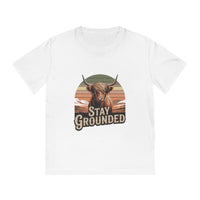 White t-shirt with a graphic of a highland cow and 'Stay Grounded' text on a white background