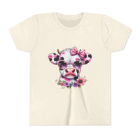 Beige t-shirt with a cow design wearing sunglasses and a bow, on a white background
