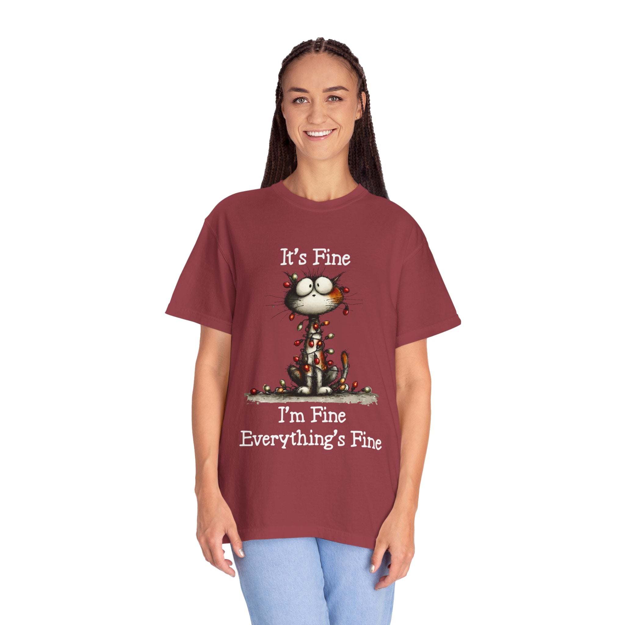 Woman wearing maroon cat t-shirt with "It’s Fine, I’m Fine, Everything’s Fine" text and small cat illustration