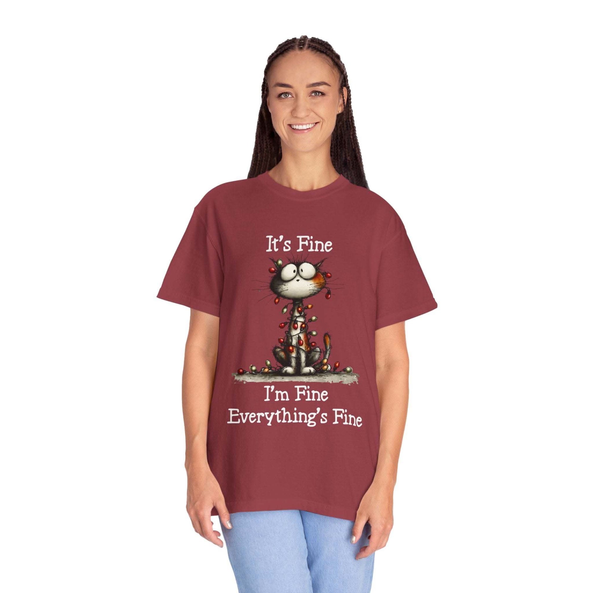 Woman wearing maroon cat t-shirt with "It’s Fine, I’m Fine, Everything’s Fine" text and small cat illustration