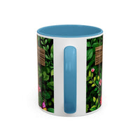 Mug with floral design and blue handle on a white background