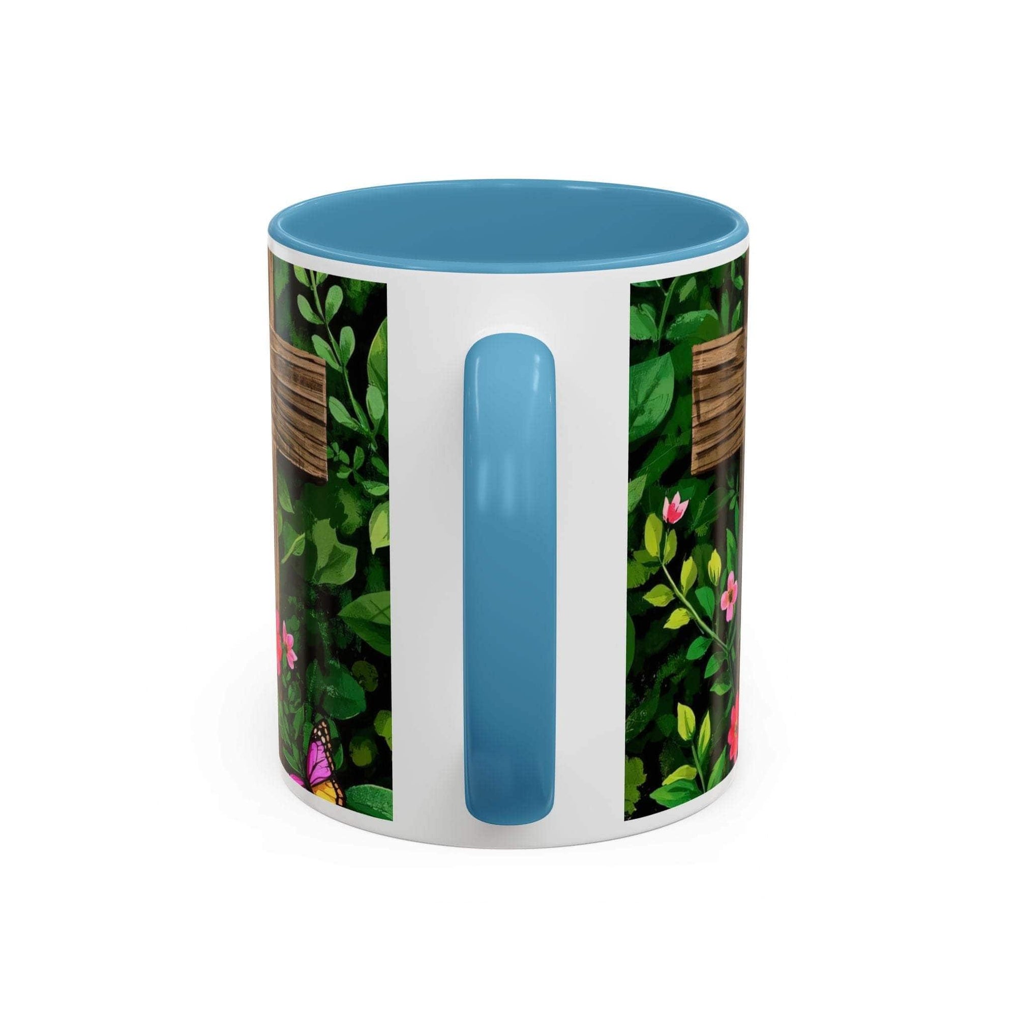 Mug with floral design and blue handle on a white background