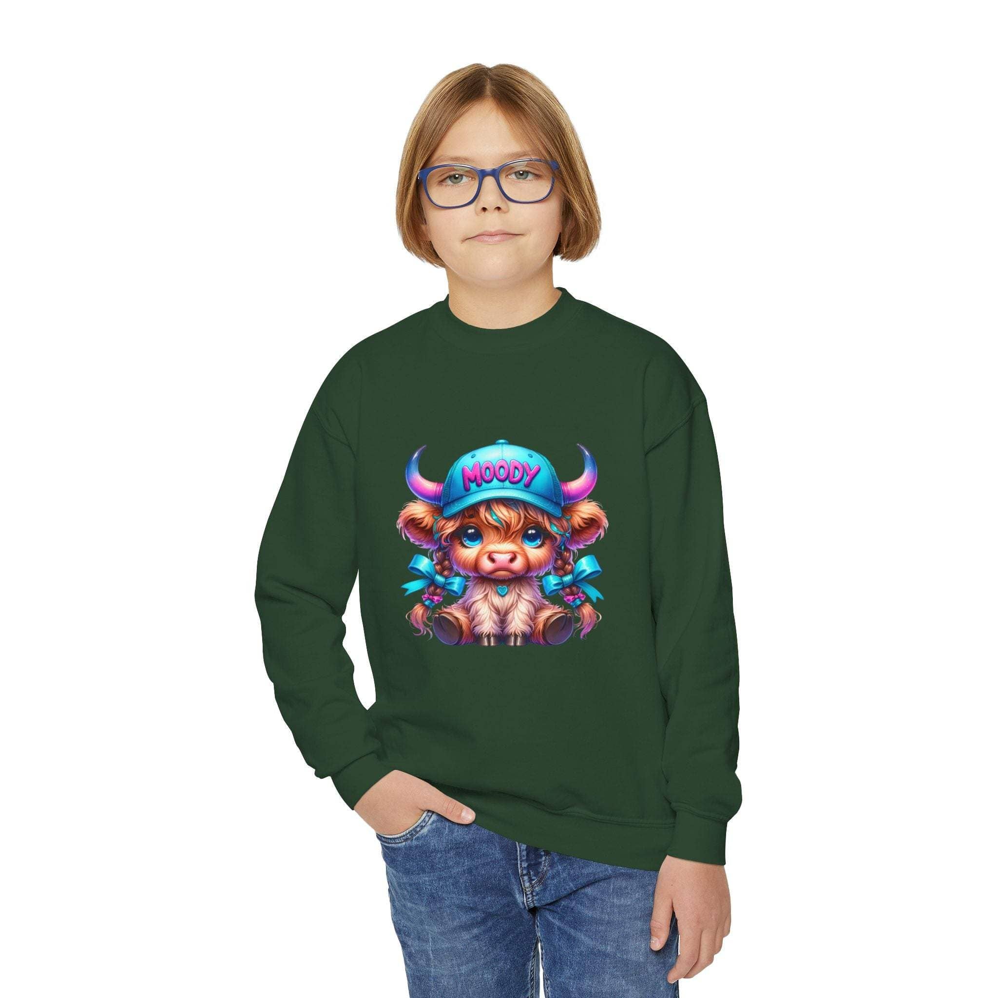 Child wearing green Moody Girl Highland Cow sweatshirt with playful cartoon cow design on front