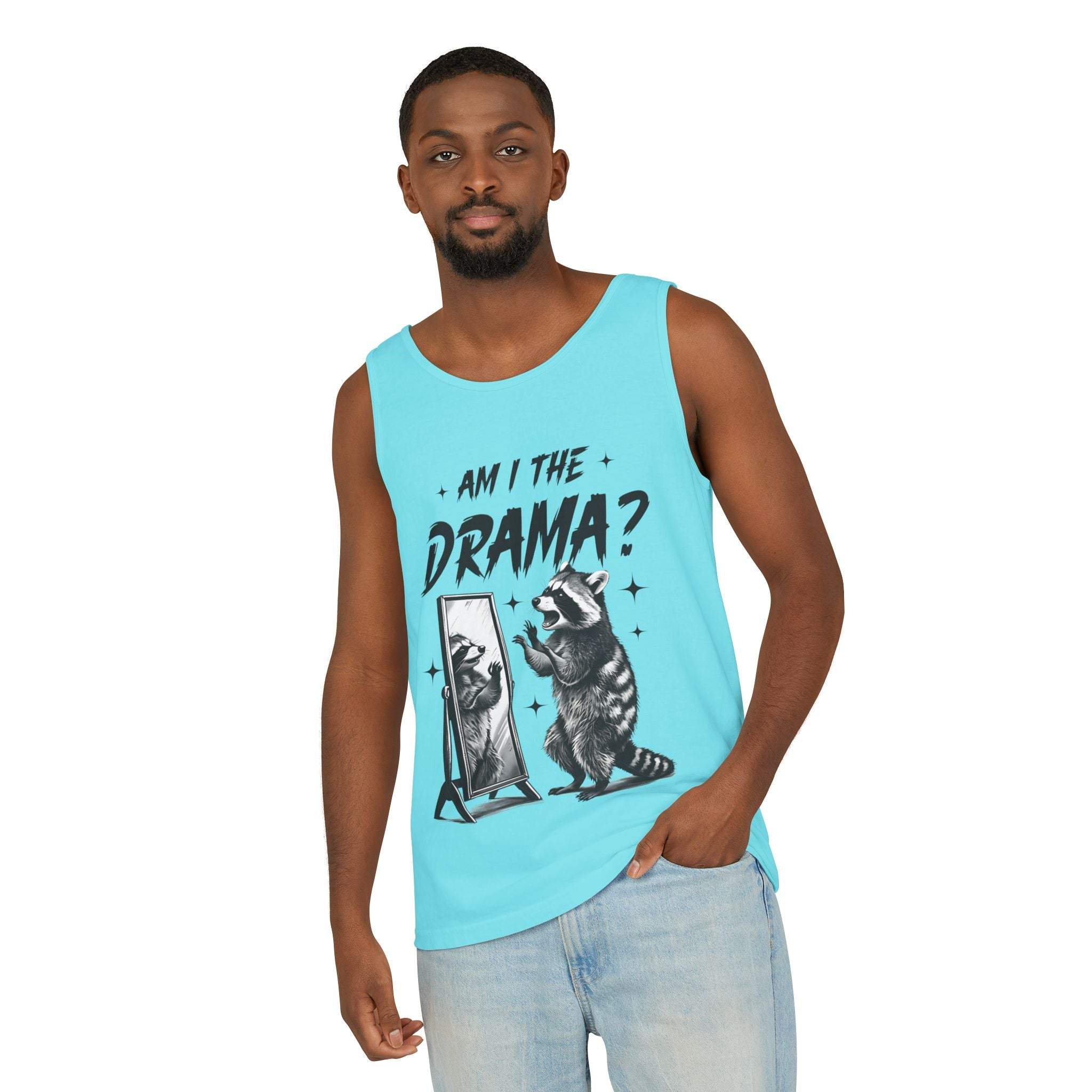 Man wearing blue tank top with "Am I The Drama?" raccoon design, casual summer fashion