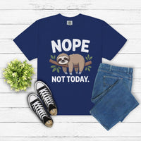 Nope Not Today Sloth T-shirt with sloth graphic and text on blue cotton fabric, paired with jeans and sneakers on white wooden background