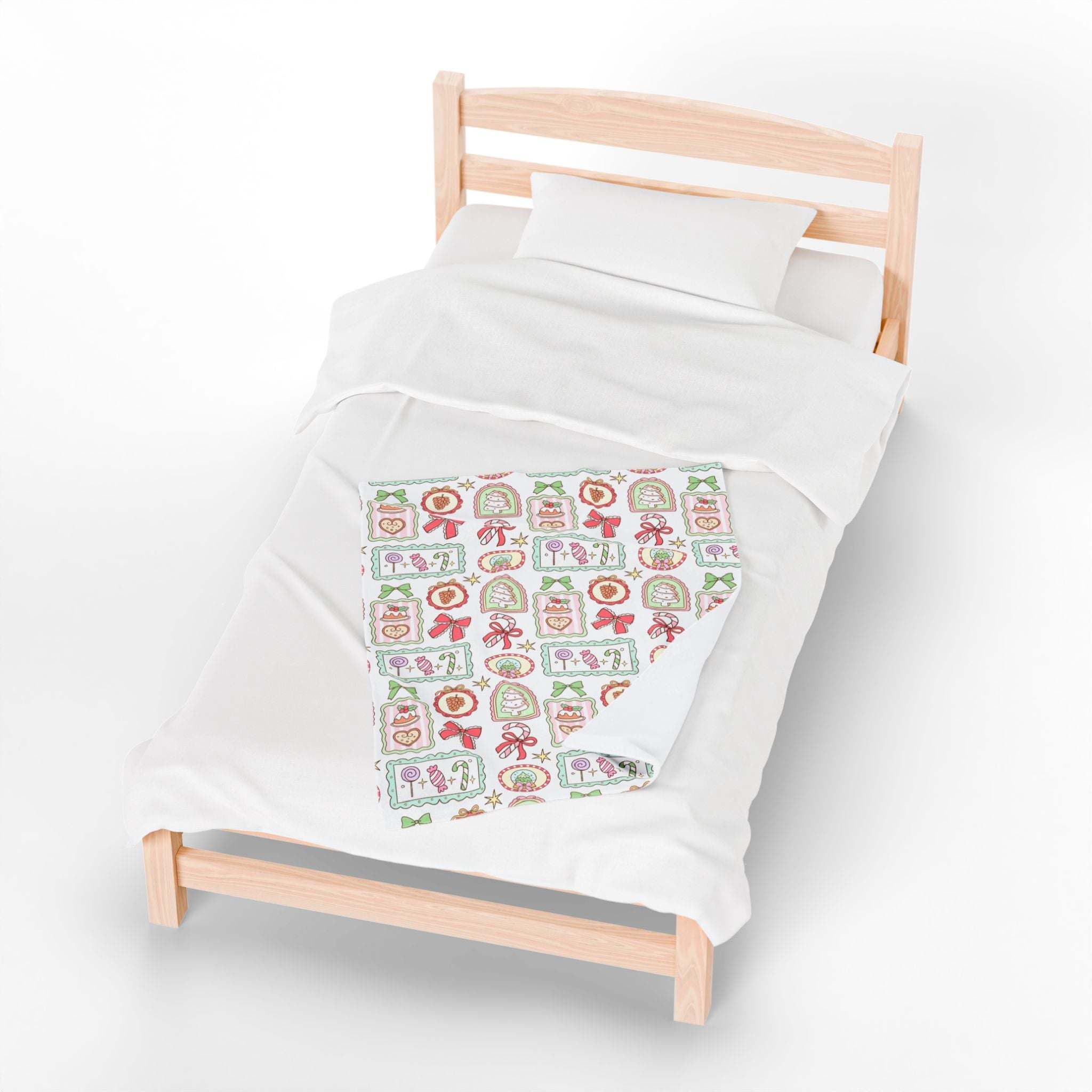 Velveteen Plush Blanket with retro Christmas frames on a bed