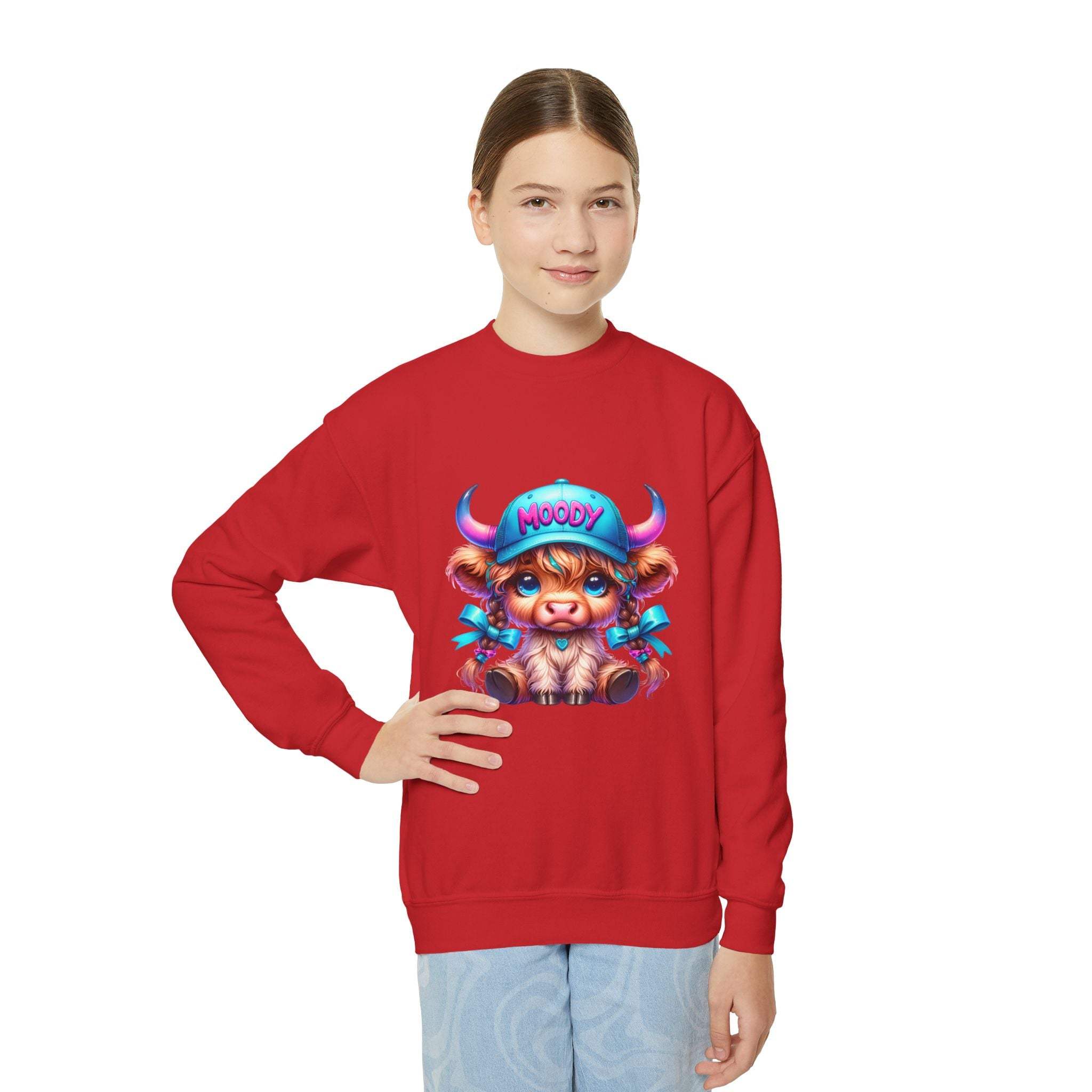 Youth wearing red Moody Girl Highland Cow sweatshirt with playful cartoon cow graphic and ribbed collar