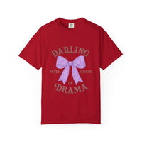 Red t-shirt with a purple bow and text on a white background