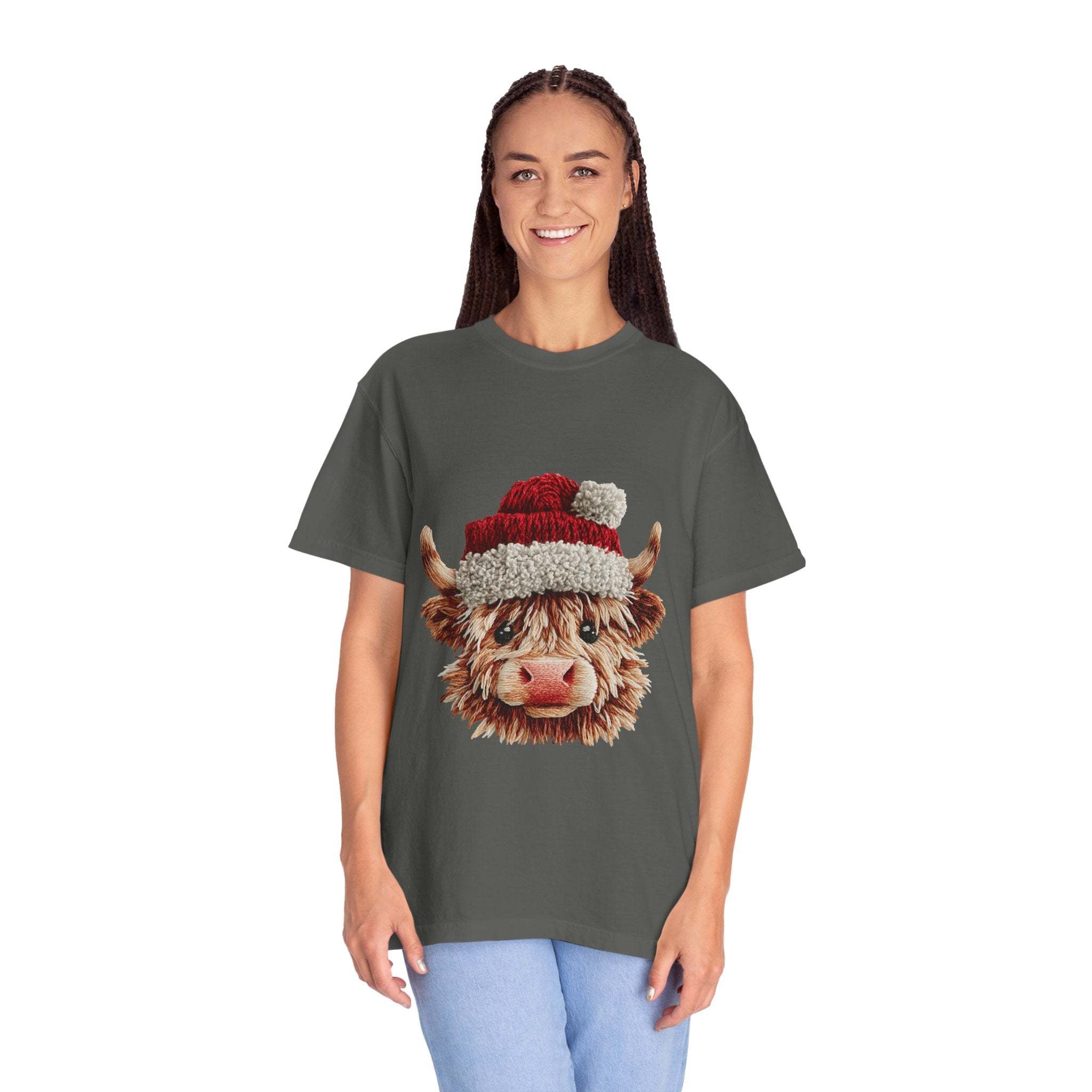 Woman wearing gray T-shirt with faux crochet yarn highland cow Santa print design
