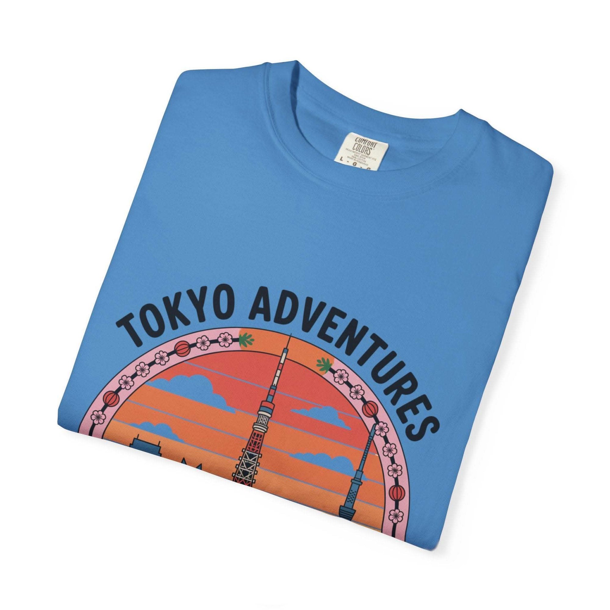 Blue garment-dyed T-shirt with Tokyo Adventures travel graphic design