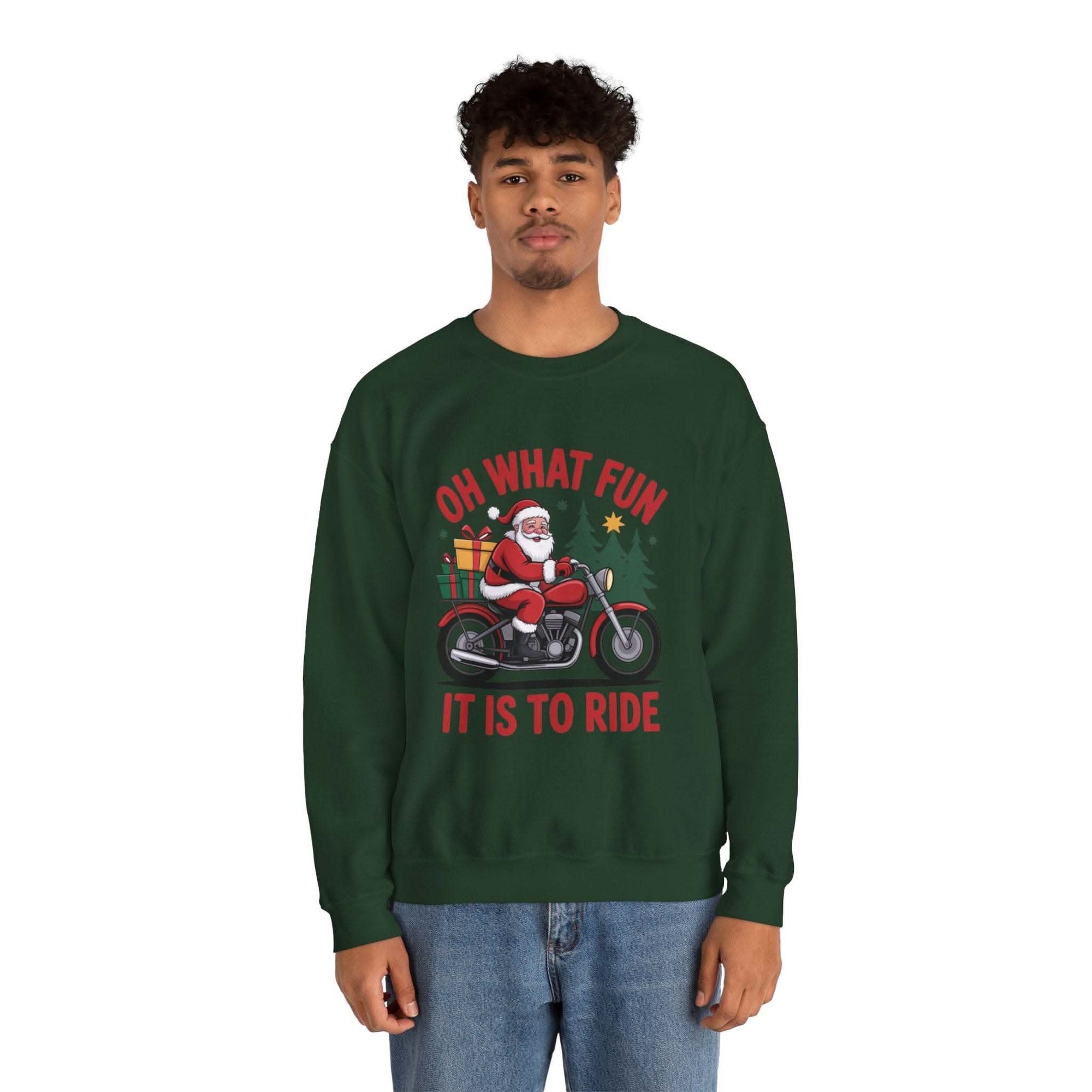 Man wearing navy Motorcycle Santa Sweatshirt with Santa on motorcycle and holiday gifts design in festive setting