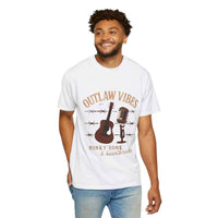 Man wearing a white t-shirt with 'Outlaw Vibes' graphic design on a white background