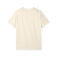 Flat lay of the back of an ivory Comfort Colors 1717 t-shirt featuring a navy cat in a red party hat and “One Year Sober. Still Weird.” lettering.