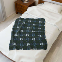 Velveteen plush blanket with winter coquette bows design on bed in cozy bedroom setting