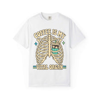 A white short-sleeve crewneck t-shirt featuring a graphic print of a rib cage with a coffee cup inside, and the text 'COFFEE IS MY VITAL ORGAN' in a beige retro font.