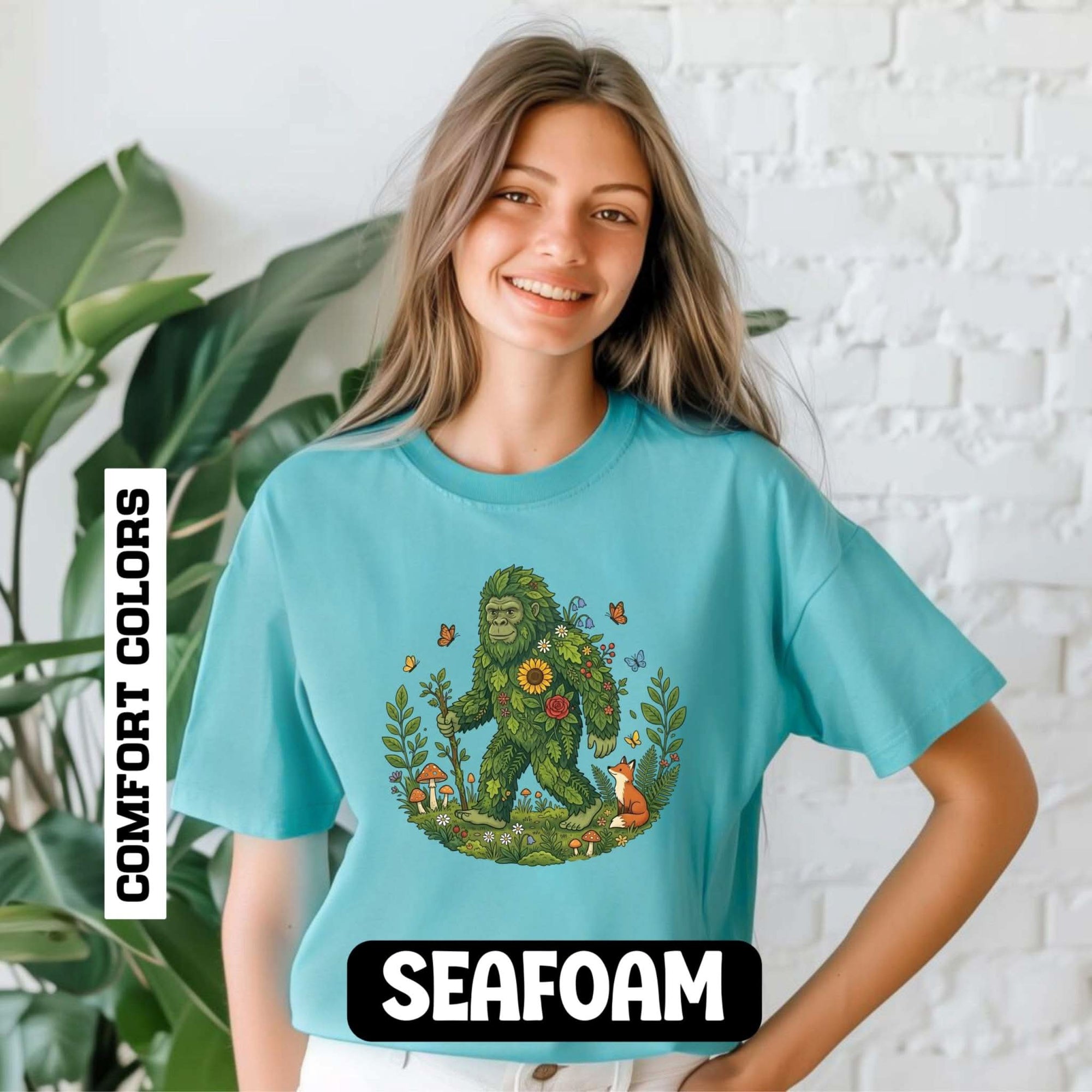 Forest Sasquatch Illustration T-shirt with floral woodland Bigfoot and wildlife design on soft garment-dyed cotton