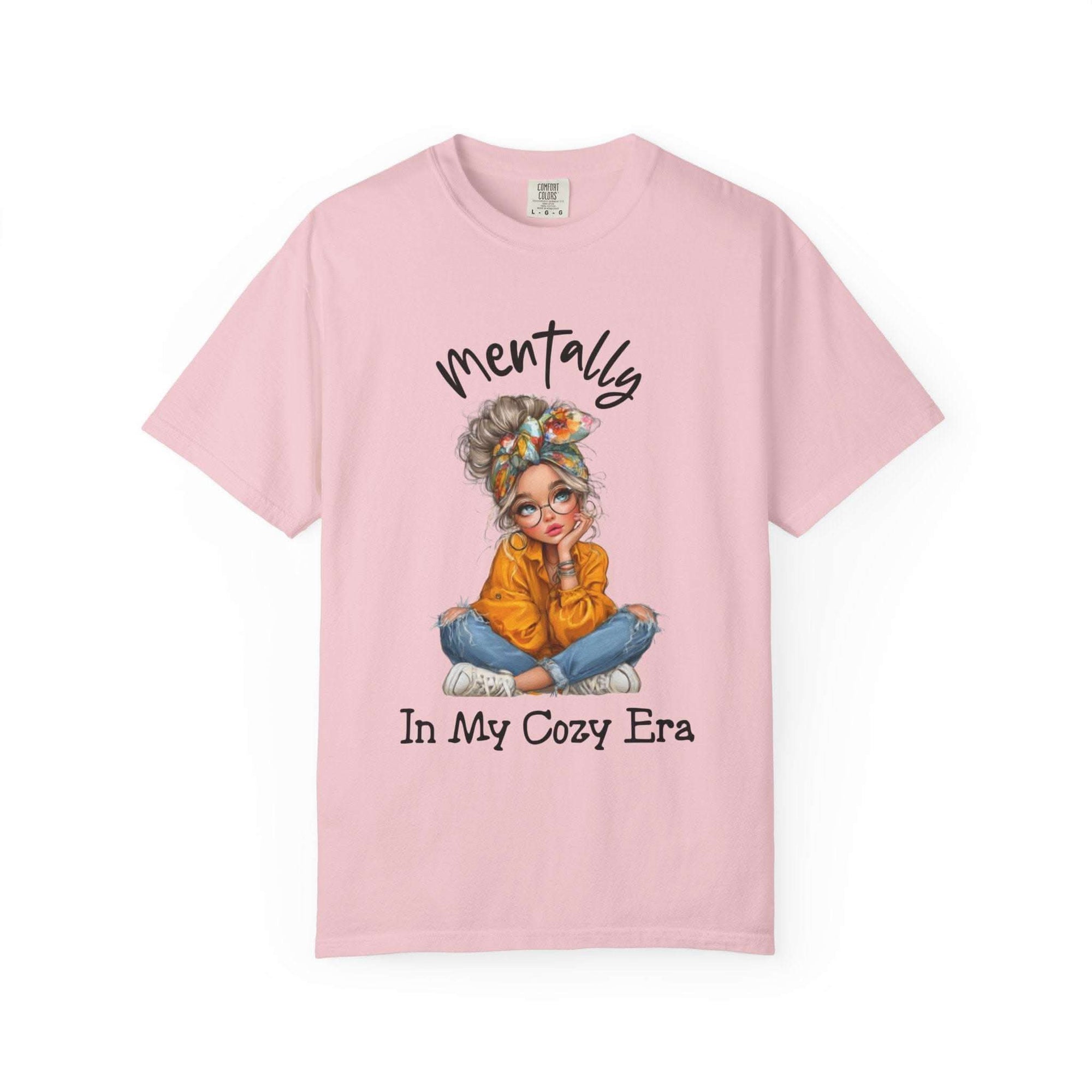 Pink t-shirt with a graphic of a woman and text on a white background