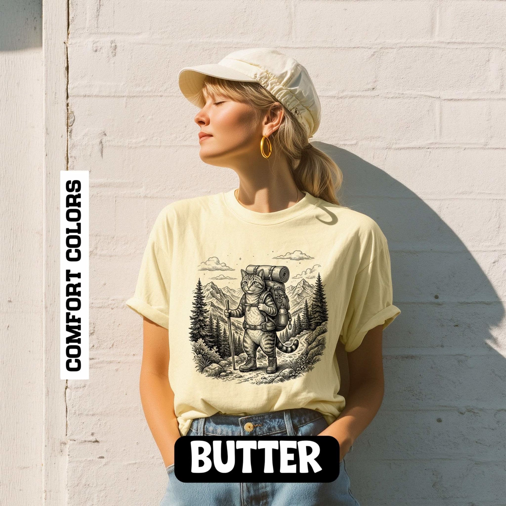 Cat hiker illustration on vintage-style heavyweight garment-dyed t-shirt with mountain camping and forest sketch design