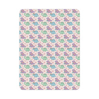 Toddler blanket with pastel dinosaurs wearing scarves on soft fleece fabric