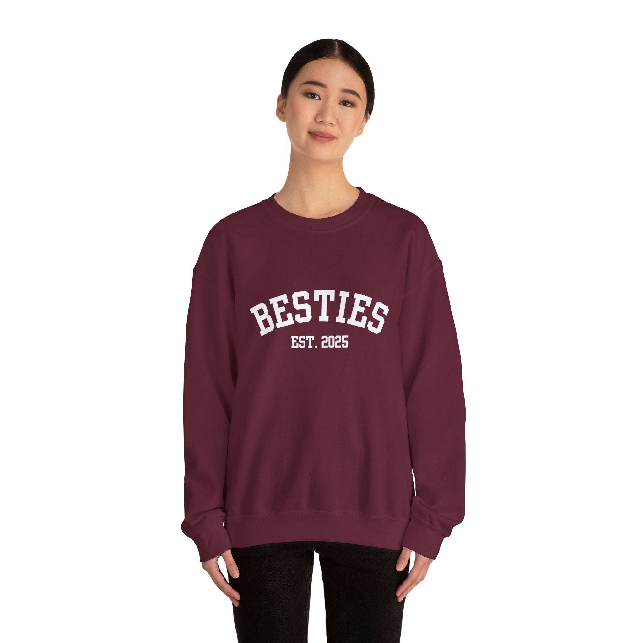 woman wearing maroon Varsity Besties Crewneck Sweatshirt with white "BESTIES EST. 2025" varsity-style lettering