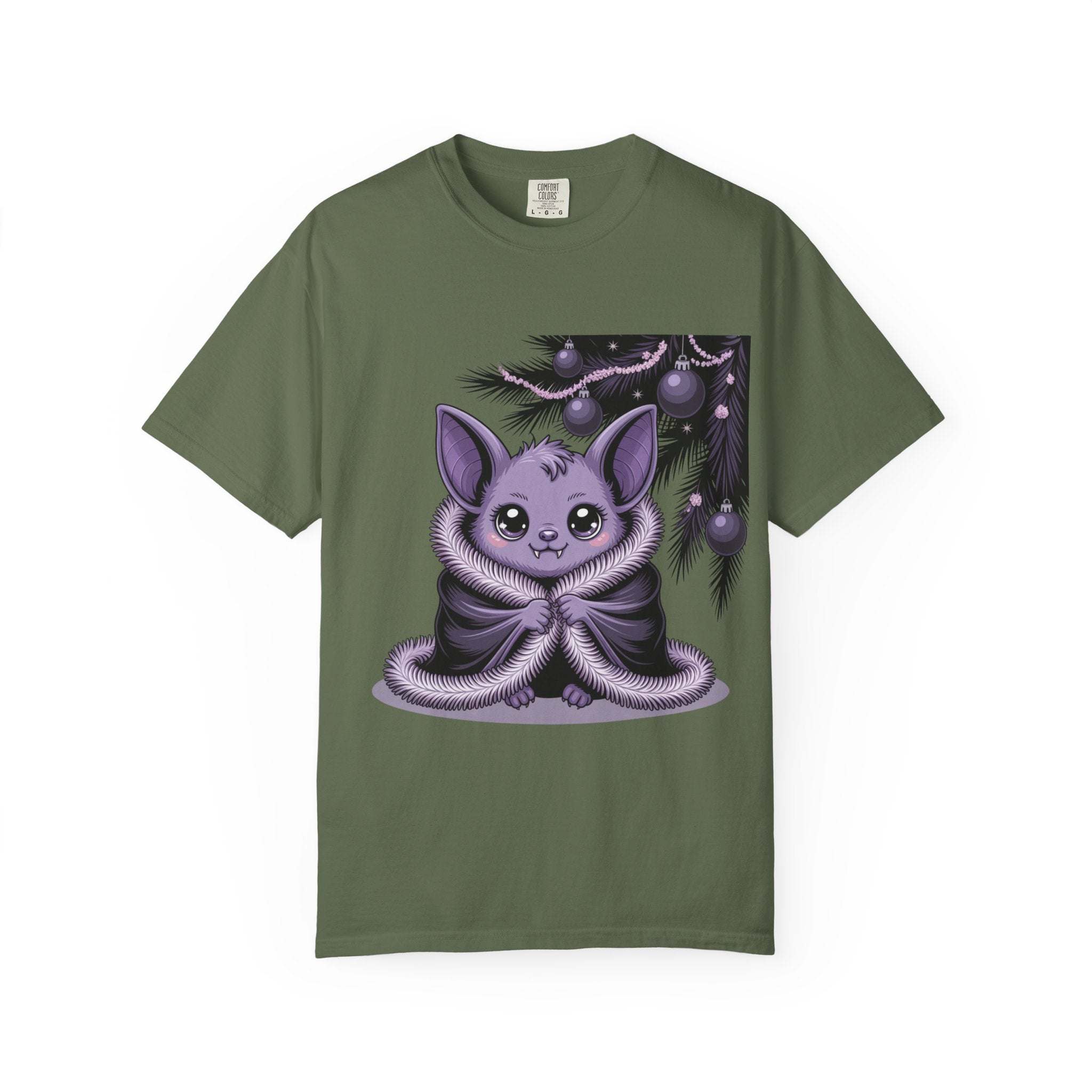 Green t-shirt with a purple creature graphic on a white background