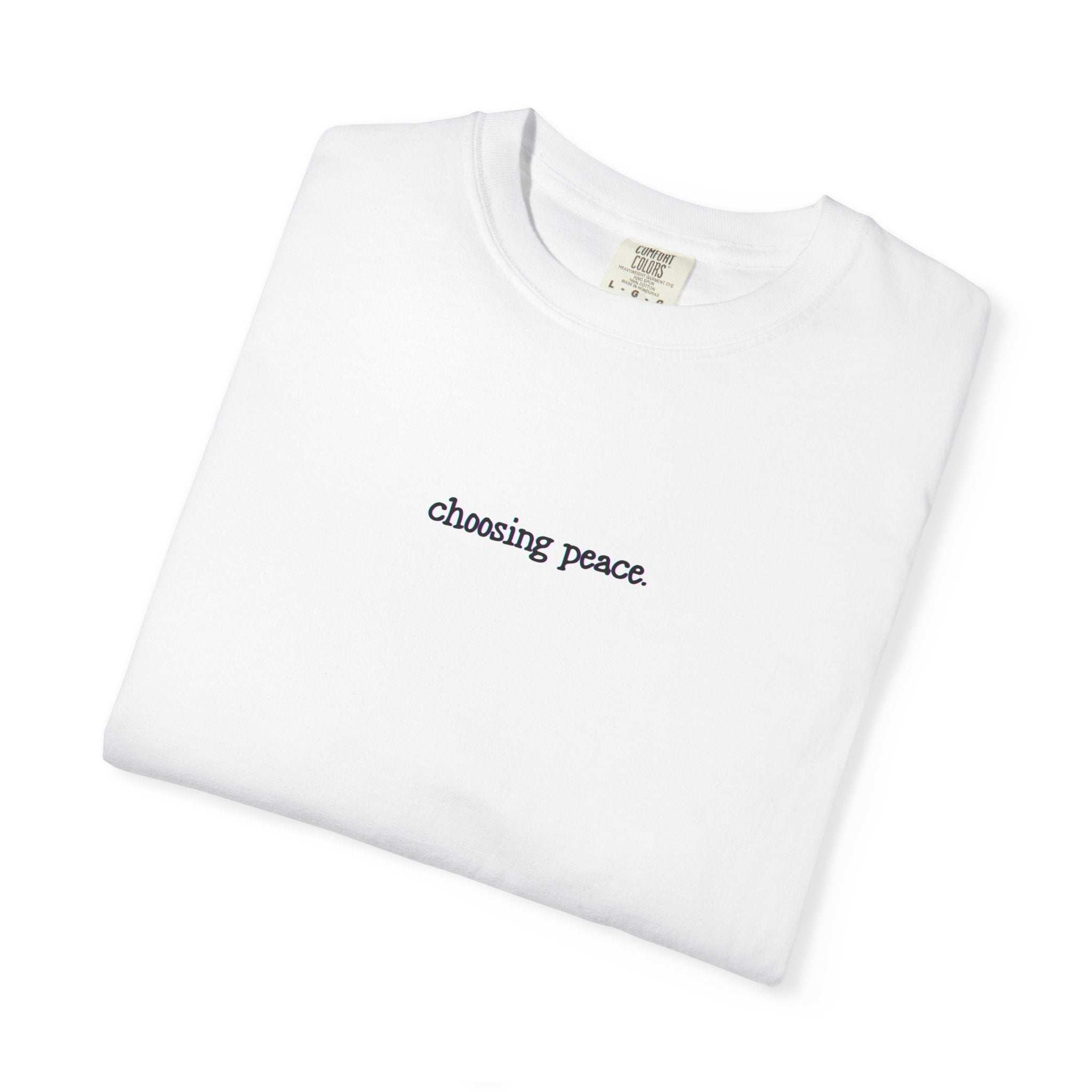 White t-shirt with 'choosing peace' text on a white background