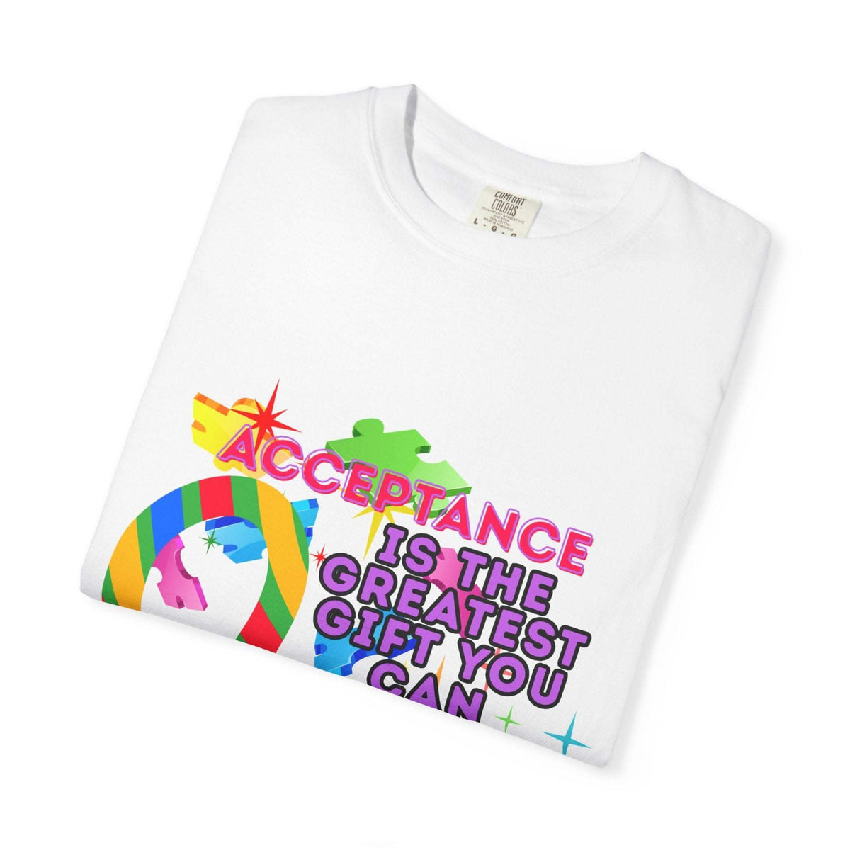 White garment-dyed T-shirt with Autism Acceptance design and colorful puzzle pieces promoting inclusivity and support